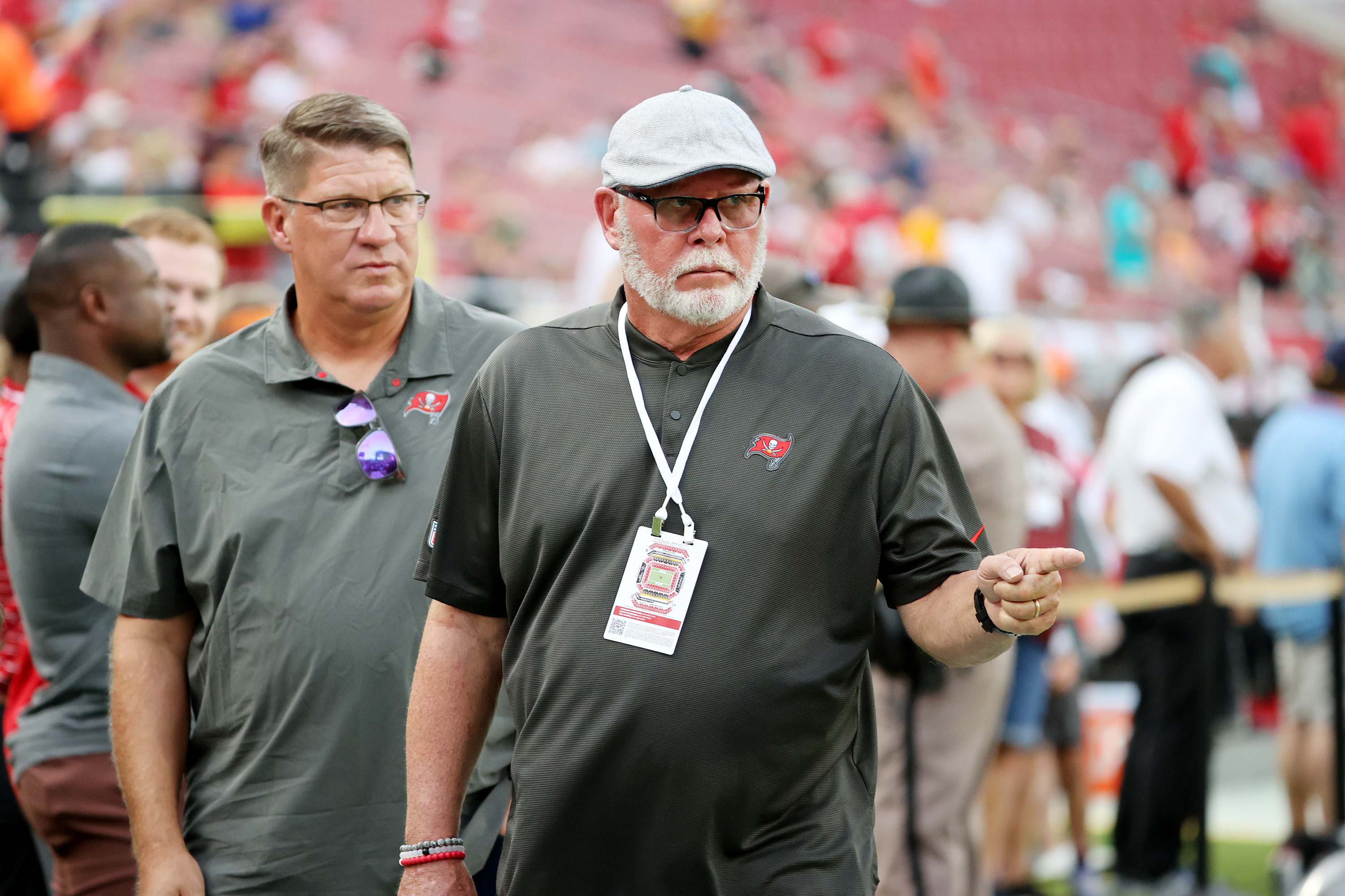 What is Buccaneers coach Bruce Arians wearing around his chest?