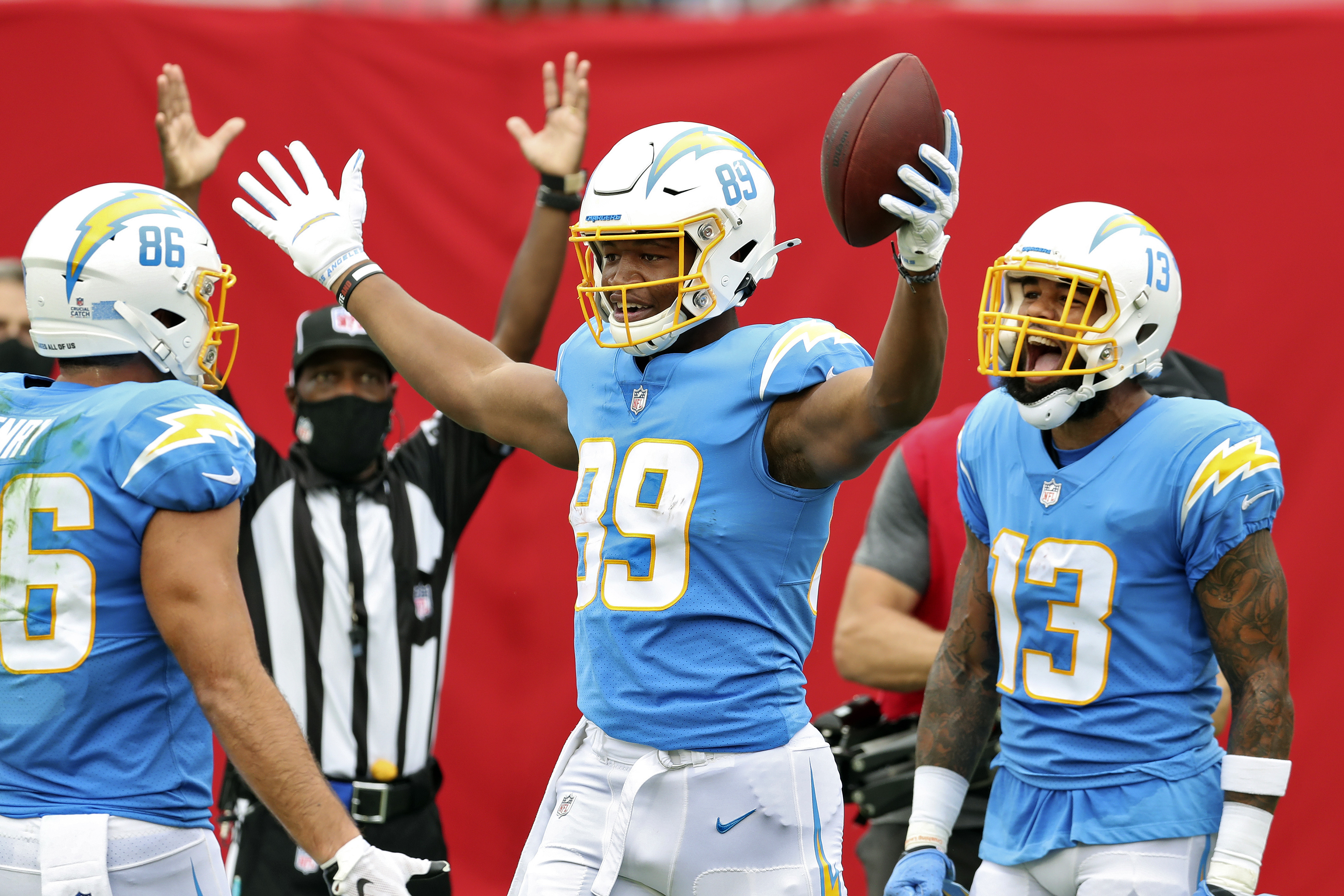 Los Angeles Chargers wide receiver Tyron Johnson (83) is defended