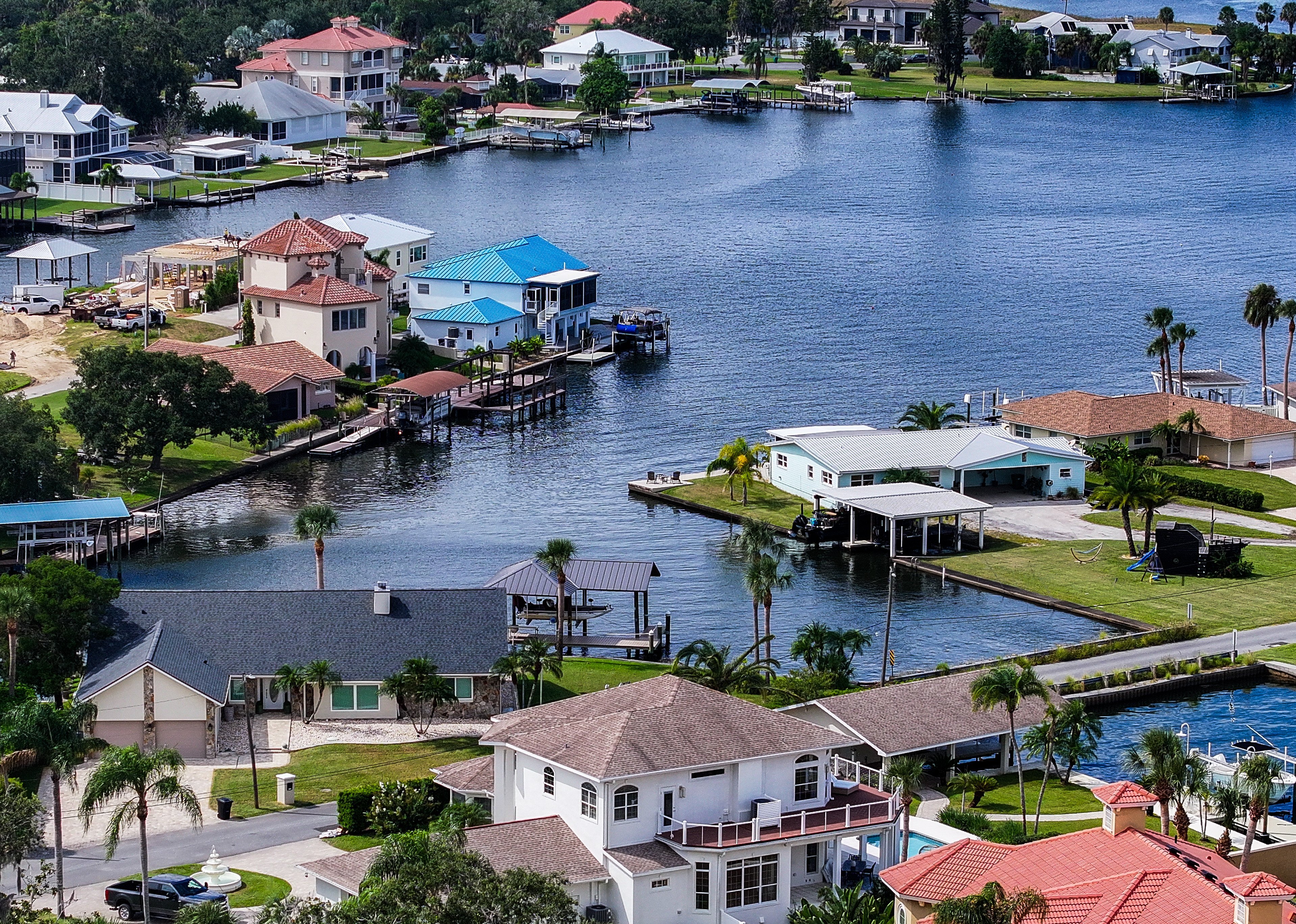 Many polluted waterways are surrounded by homes and streets that generate runoff. Houses sit just paces from the water in Crystal River, a popular spot to swim and kayak near Florida manatees.