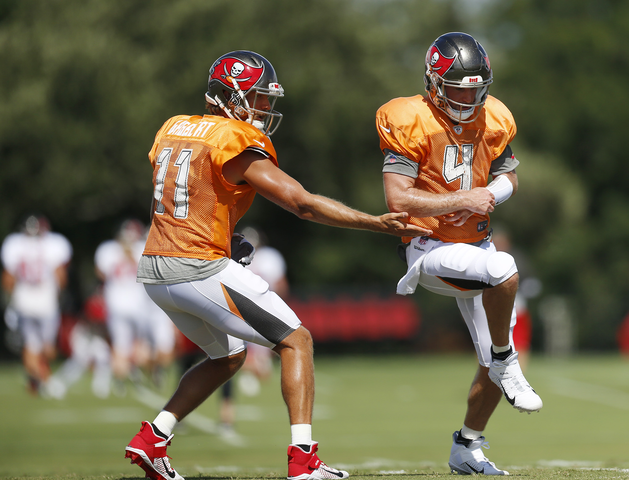 Tampa Bay Buccaneers quarterback Blaine Gabbert (11) talks with quarterback  Ryan Griffin (4) and quarterback Tom Brady (12) before an NFL preseason  preseason football game against the Indianapolis Colts in Indianapolis,  Saturday