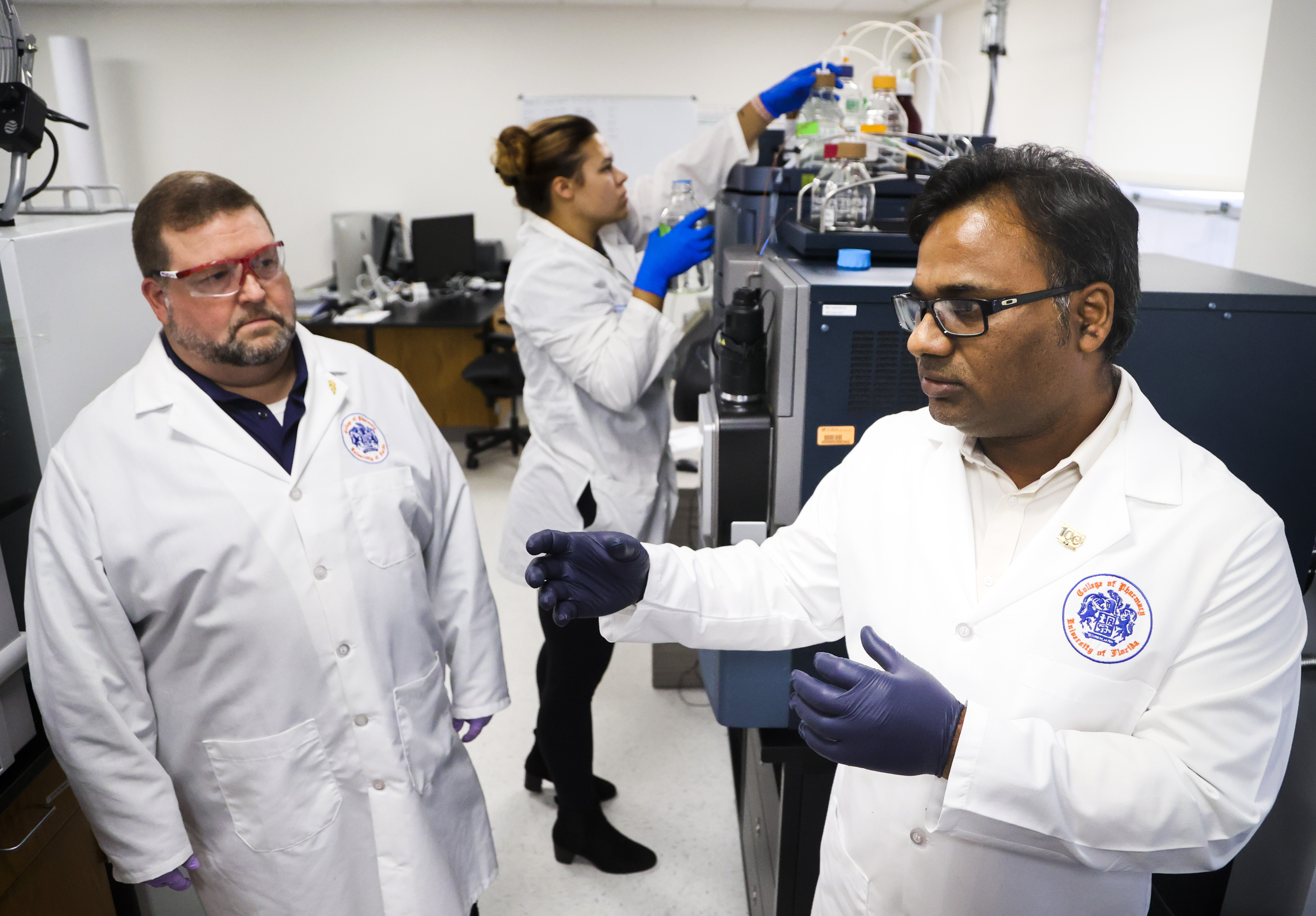 Christopher McCurdy, left, and Abhisheak Sharma study kratom at the University of Florida. They’re worried about concentrated forms of the herb, including power-packed liquid shots.