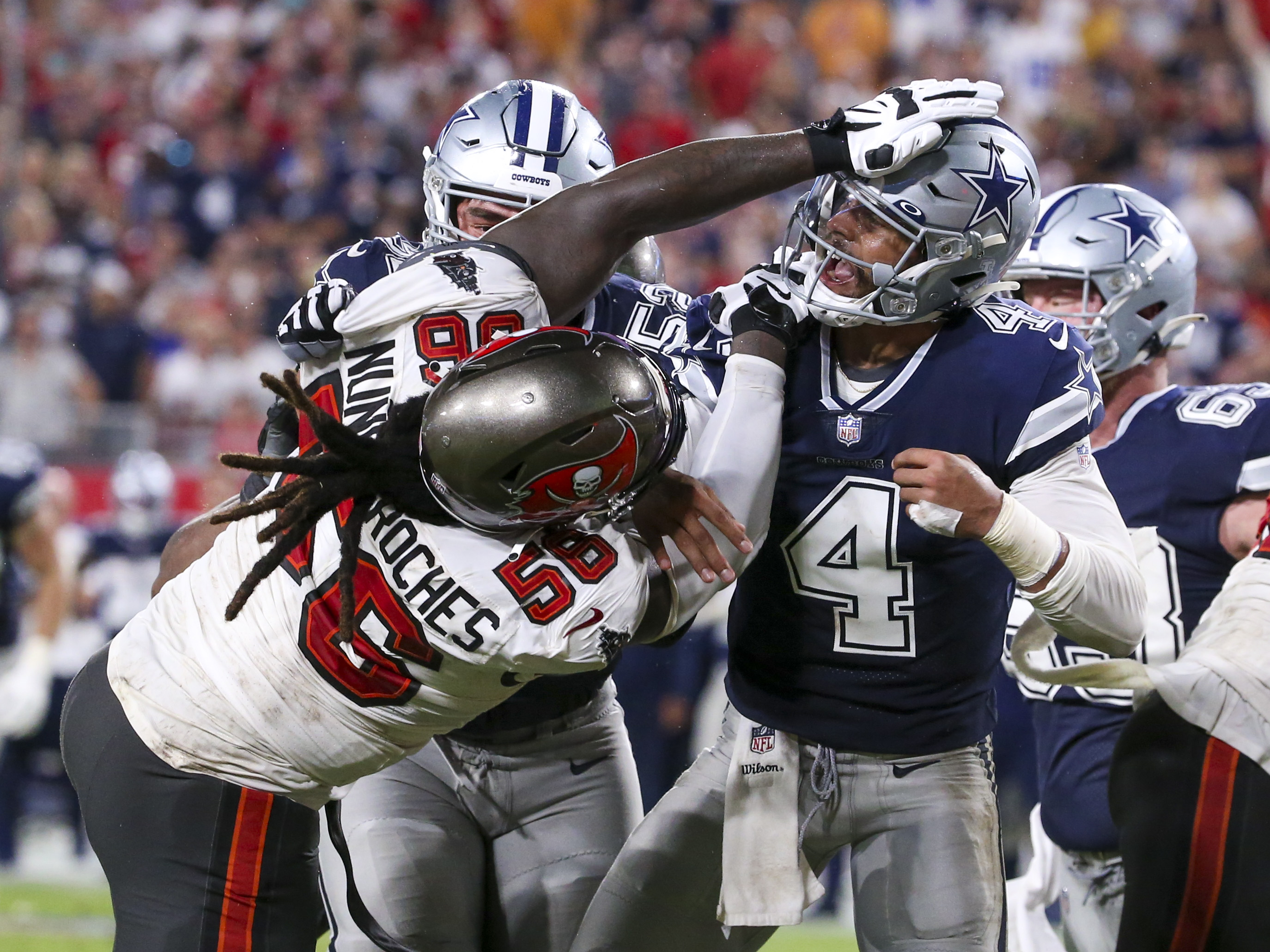 Tampa Bay Buccaneers defensive tackle Rakeem Nunez-Roches (56) with a smart  phone celebrating after an NFL football game against the Seattle Seahawks  on Nov. 13, 2022, in Munich. The Buccaneers defeated the