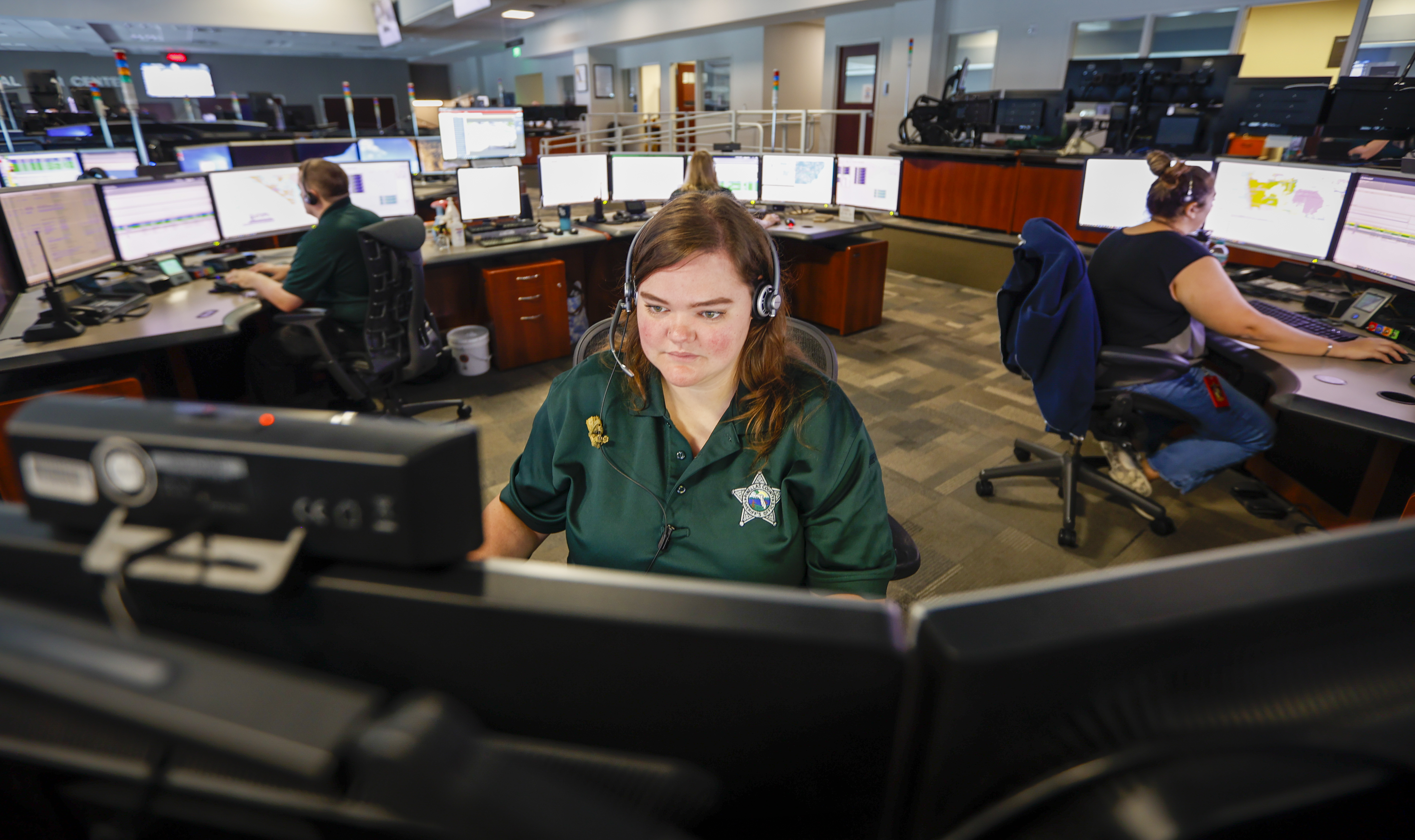 She's the invisible link between 911 callers and cops