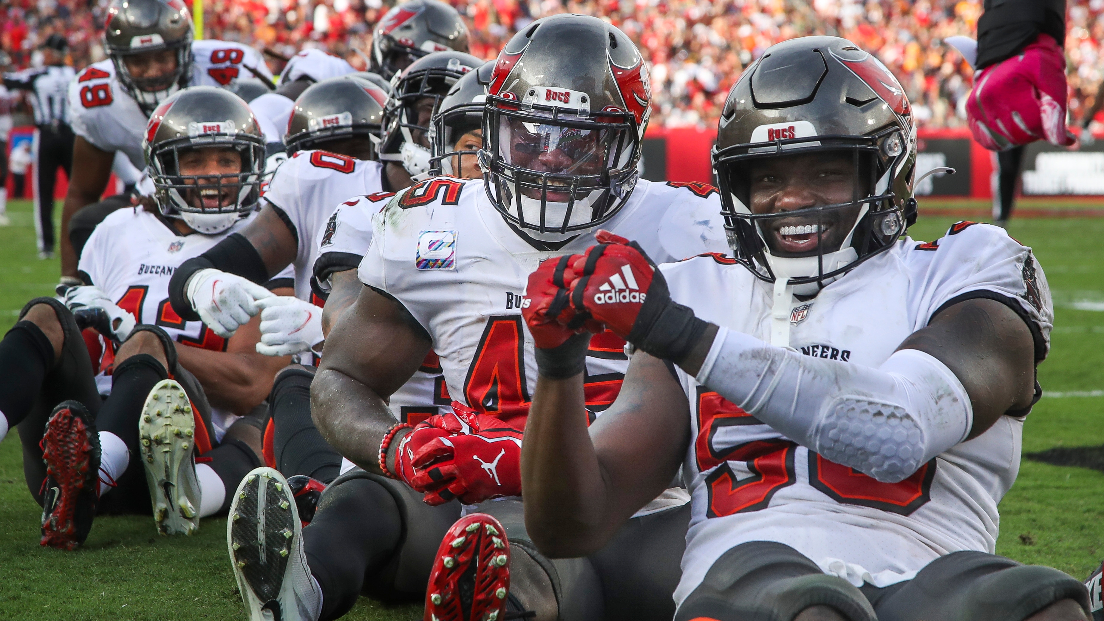 The Tampa Bay Buccaneers defense celebrates an interception during