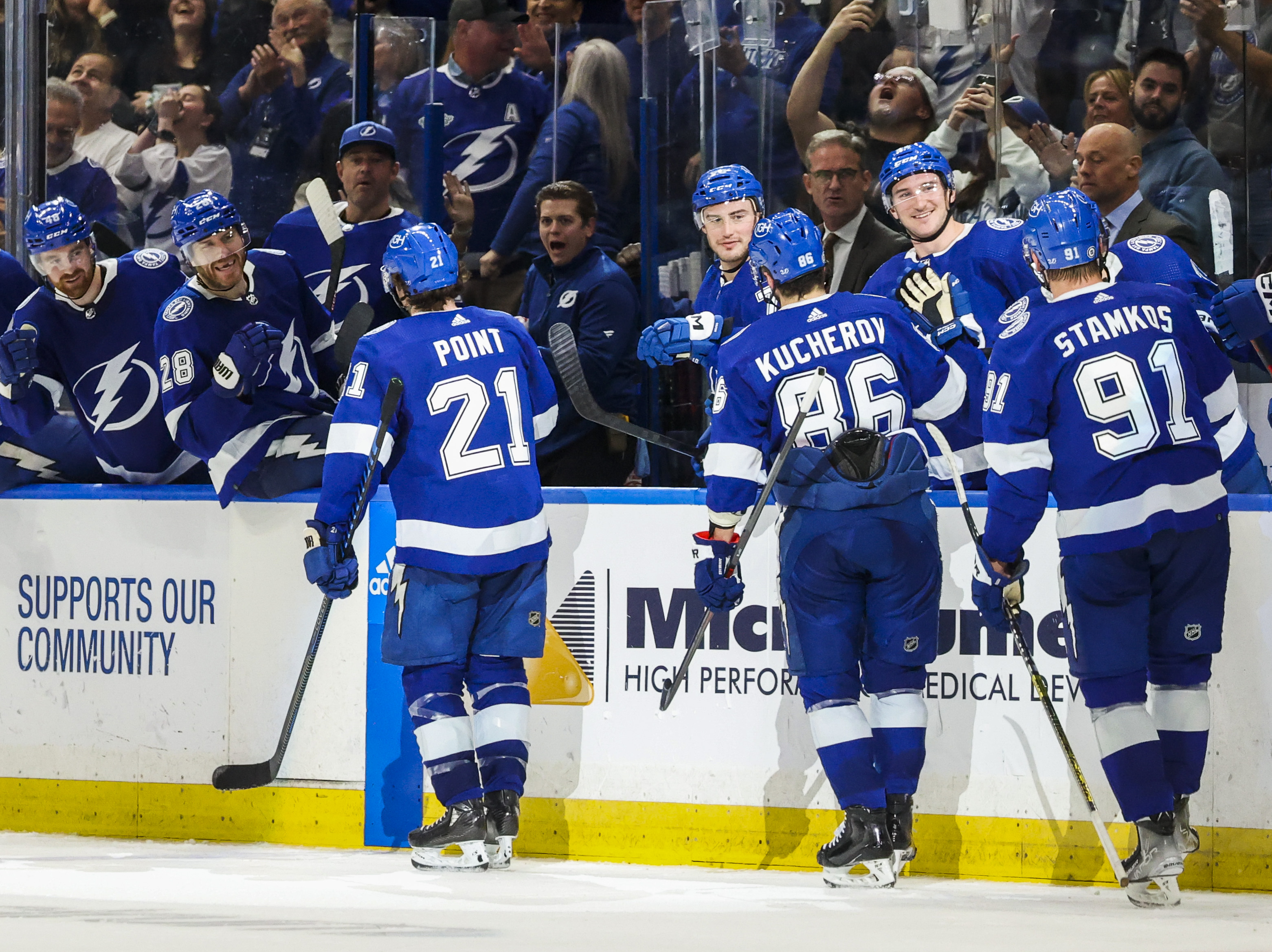 Tampa Bay Lightning center Michael Eyssimont (23) battles for the