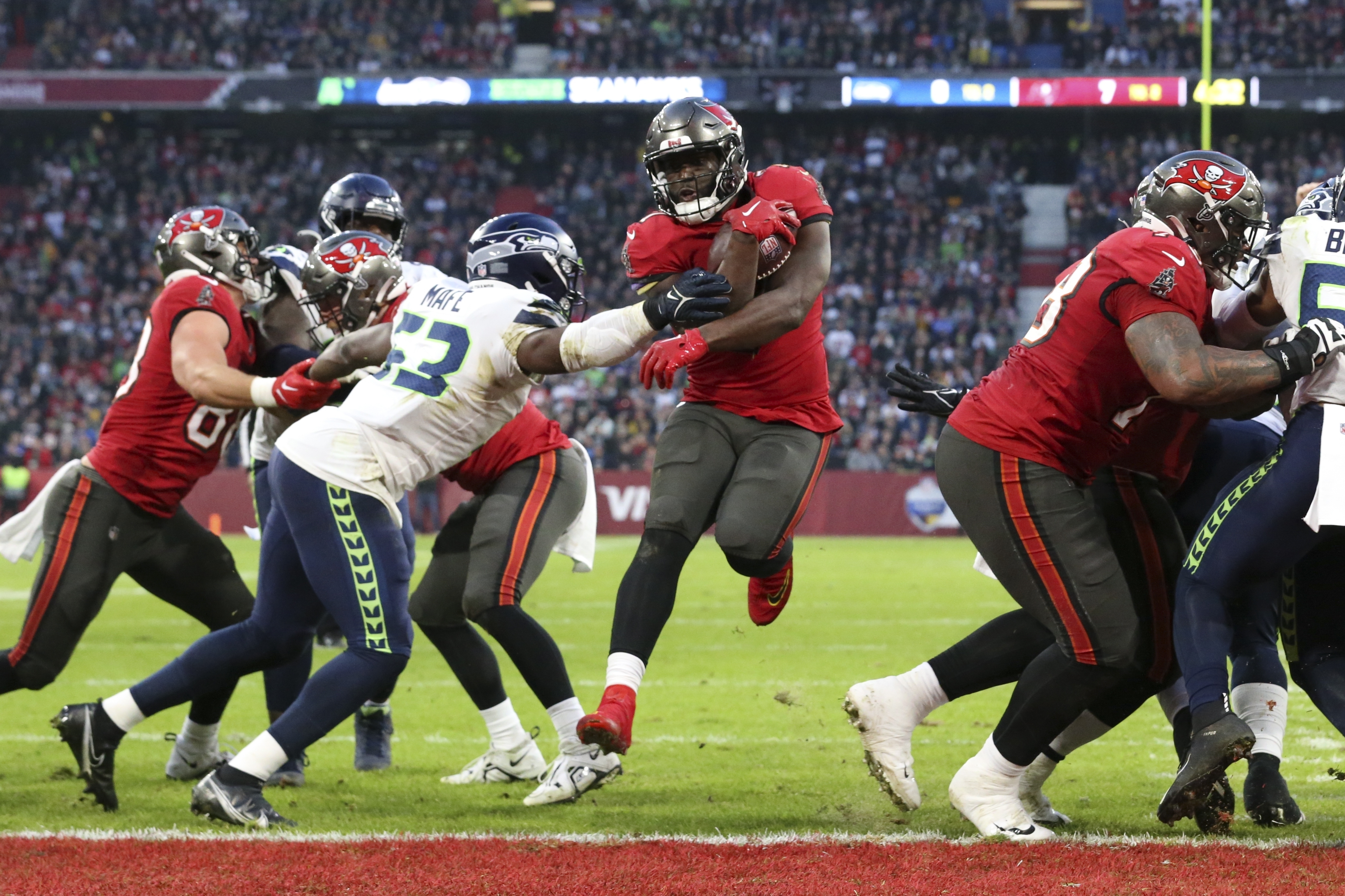 Tampa Bay Buccaneers wide receiver Mike Evans (13) stiff-arms Seattle  Seahawks safety Quandre Diggs (6) during an NFL football game on Nov. 13,  2022, in Munich. The Buccaneers defeated the Seahawks 21-16. (