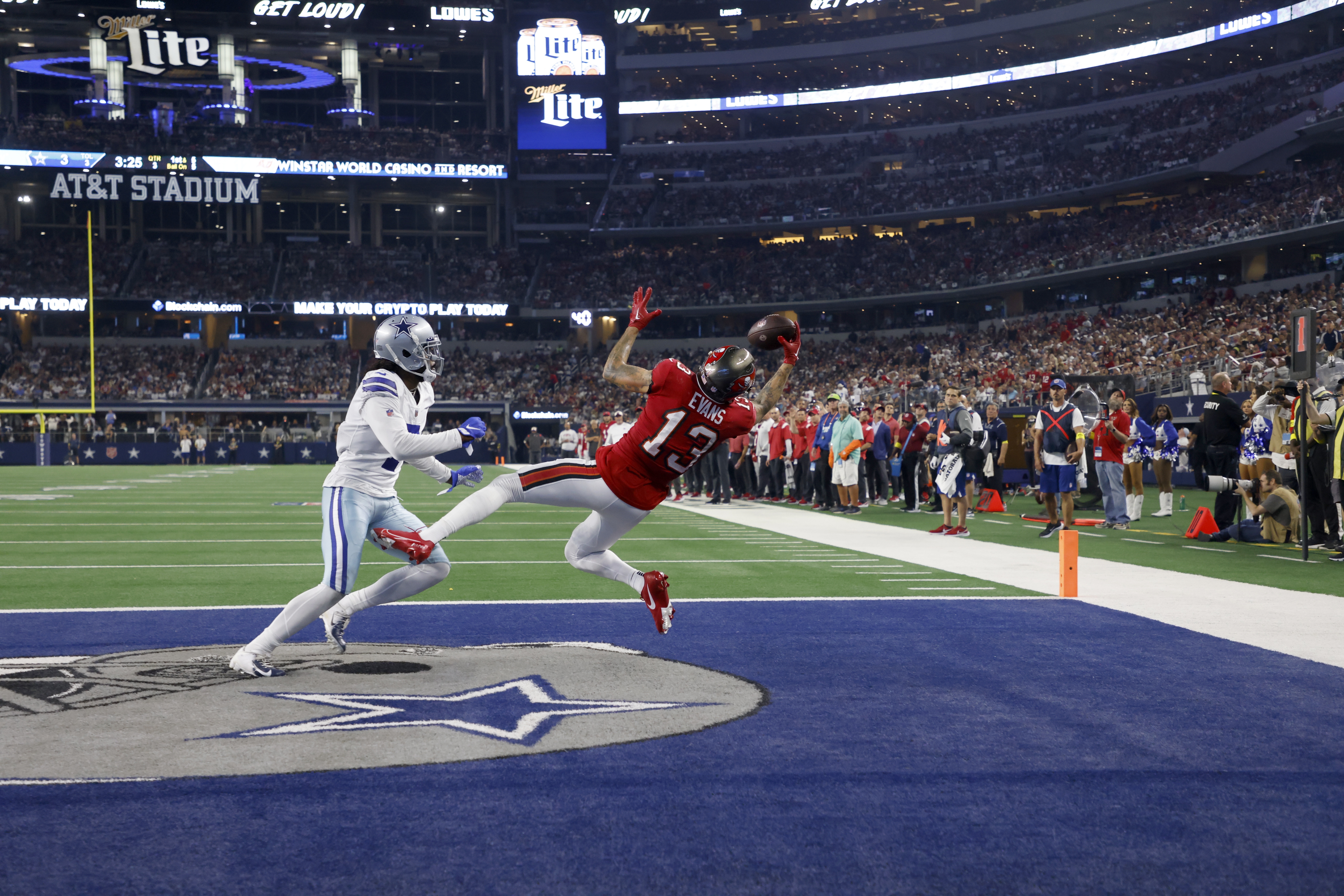 Tampa Bay Buccaneers wide receiver Mike Evans (13) stiff-arms Seattle  Seahawks safety Quandre Diggs (6) during an NFL football game on Nov. 13,  2022, in Munich. The Buccaneers defeated the Seahawks 21-16. (