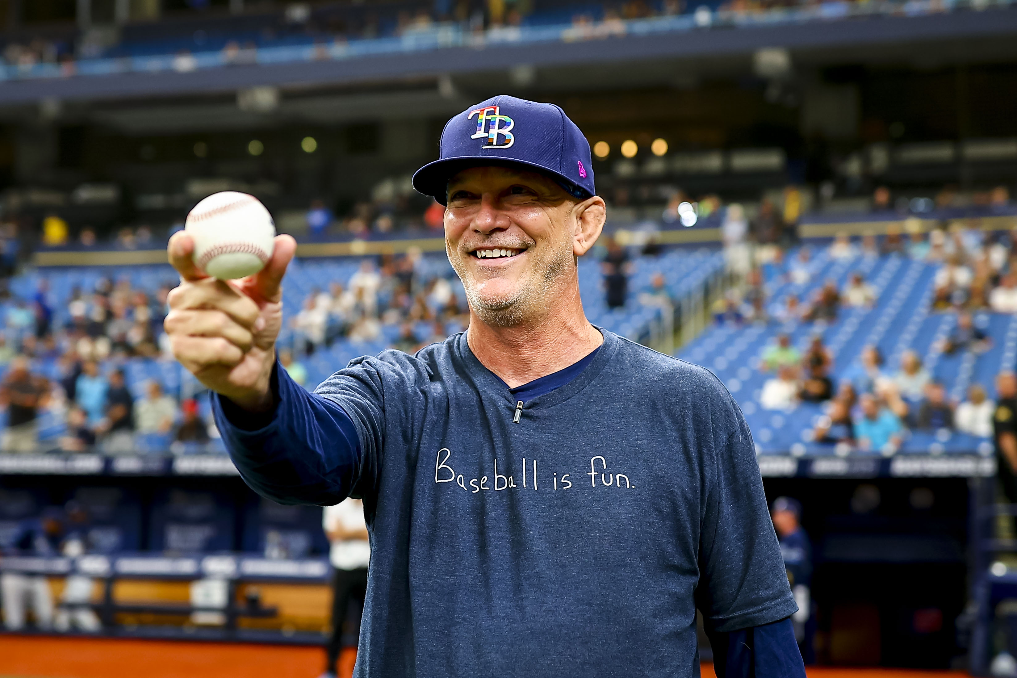 Paul Lamison's daughter throws first pitch as Rays remember life and legacy  of WFLA's Chief Photojournalist
