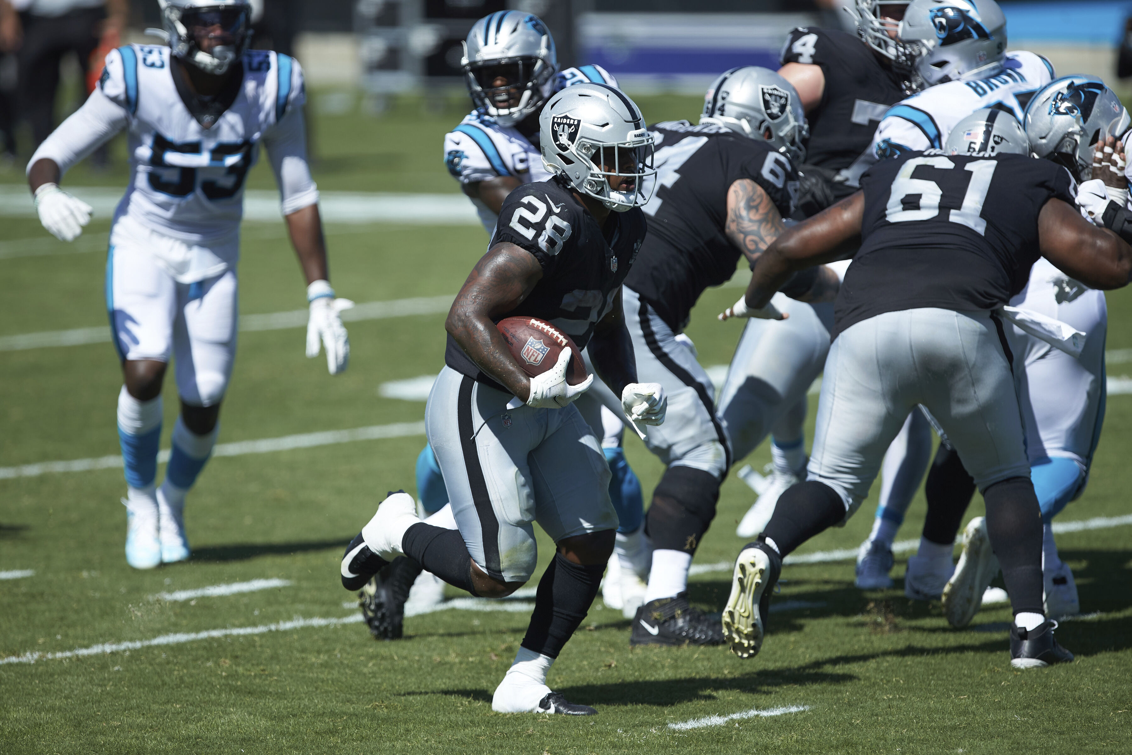 Las Vegas Raiders running back Josh Jacobs (28) gains yards on a