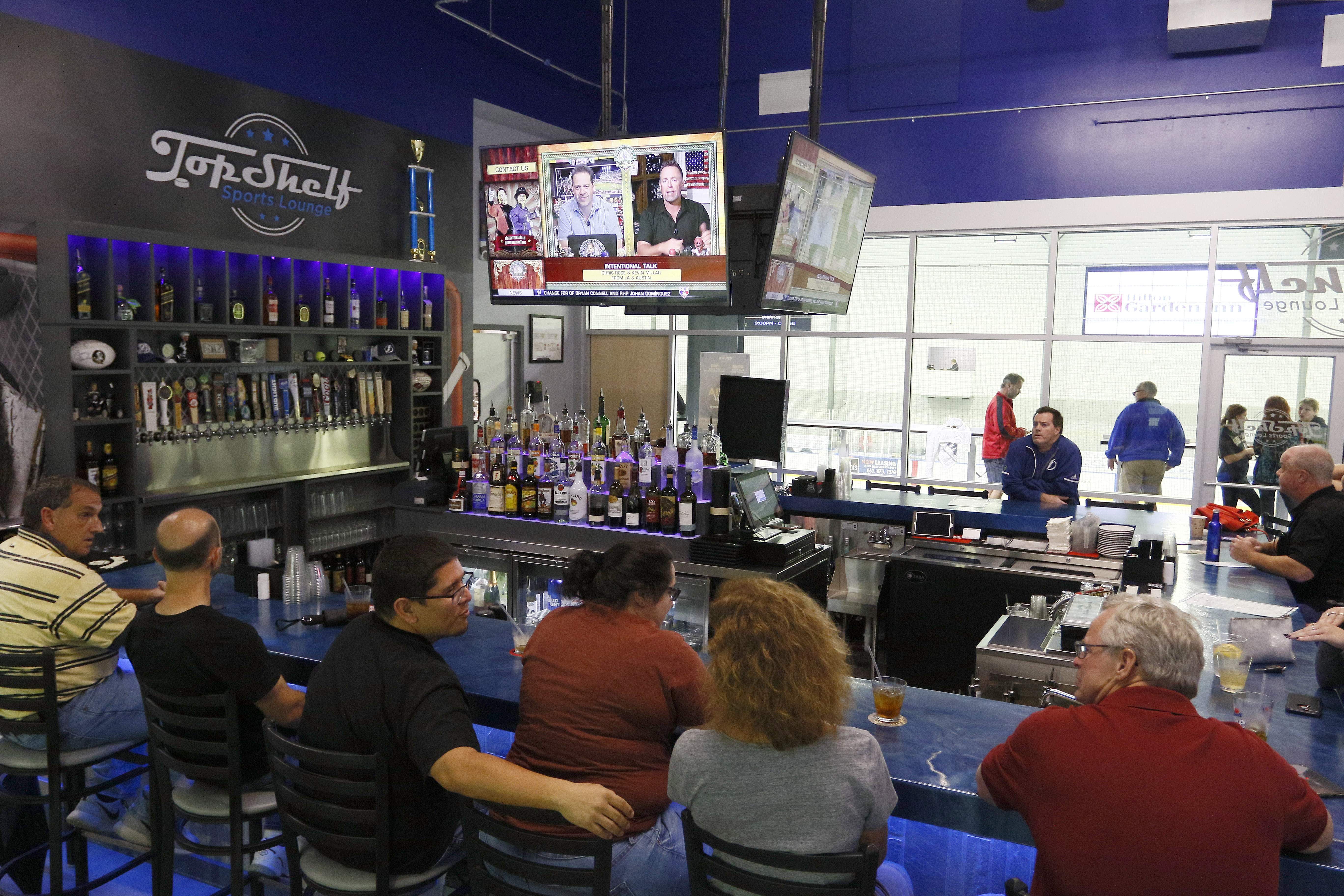 Bar review: At Top Shelf Sports Lounge, beer comes with side of hockey rinks
