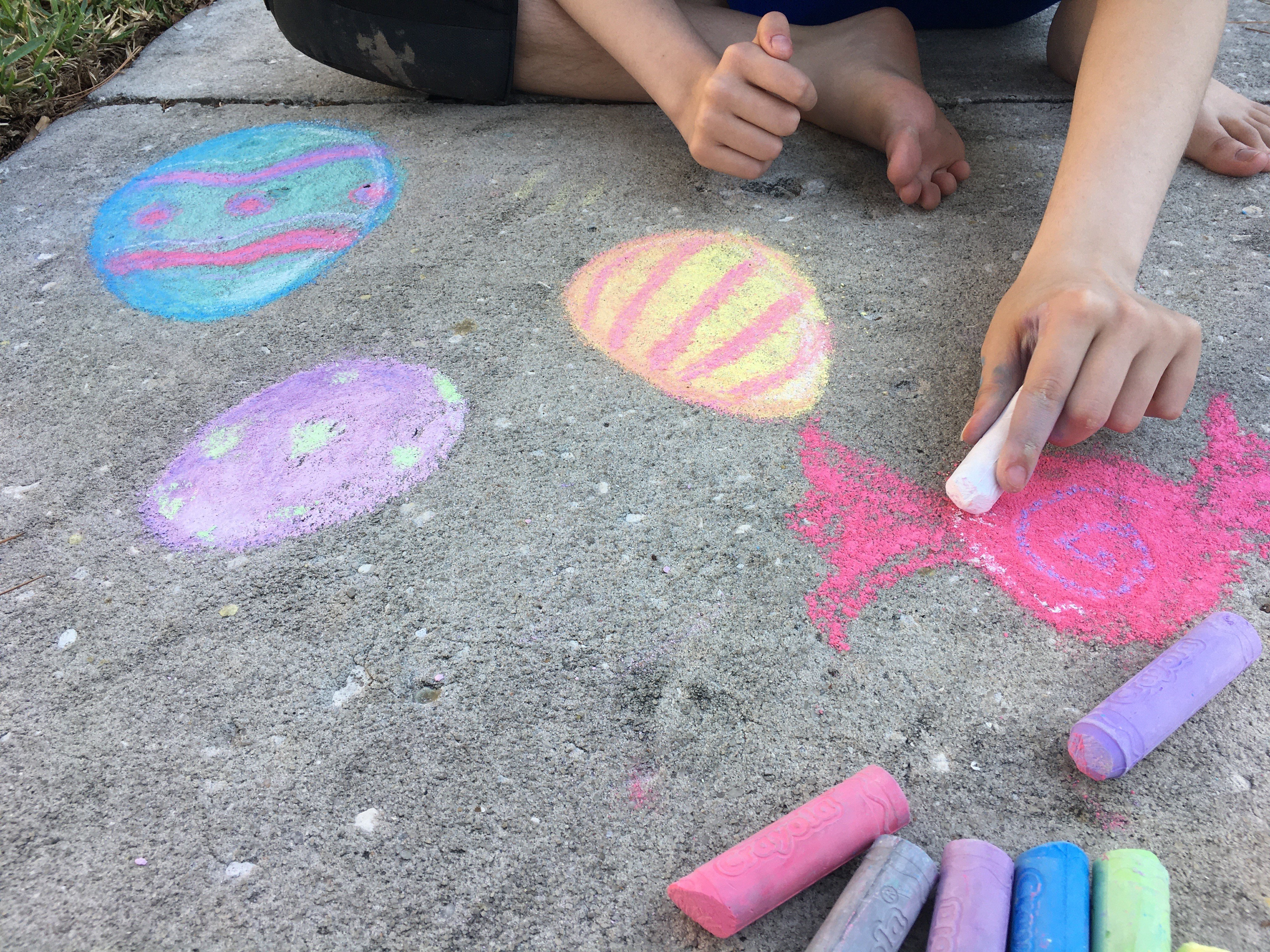 As Rain Falls On Tampa Bay Sidewalk Chalk Art Melts Away