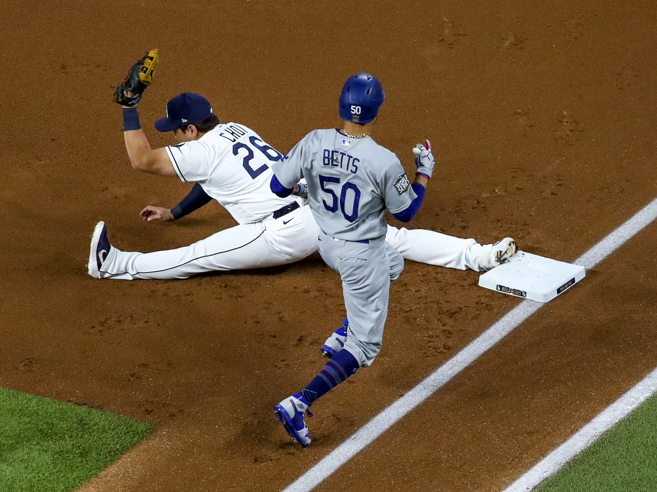 Los Angeles Dodgers' Mookie Betts steals second past Tampa Bay Rays  shortstop Willy Adames during the sixth inning in Game 3 of the baseball World  Series Friday, Oct. 23, 2020, in Arlington