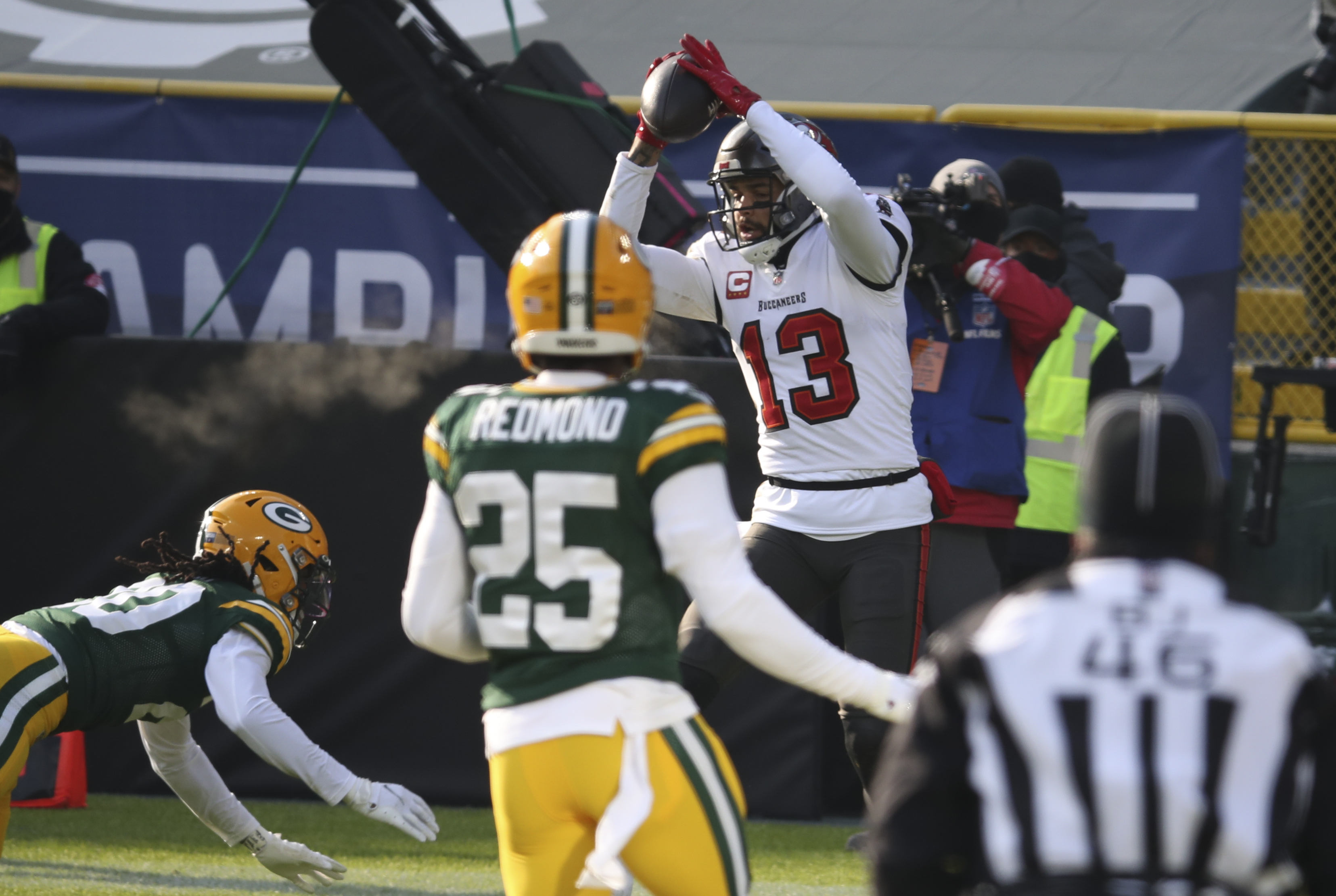 Tampa Bay Buccaneers wide receiver Mike Evans (13) stiff-arms Seattle  Seahawks safety Quandre Diggs (6) during an NFL football game on Nov. 13,  2022, in Munich. The Buccaneers defeated the Seahawks 21-16. (