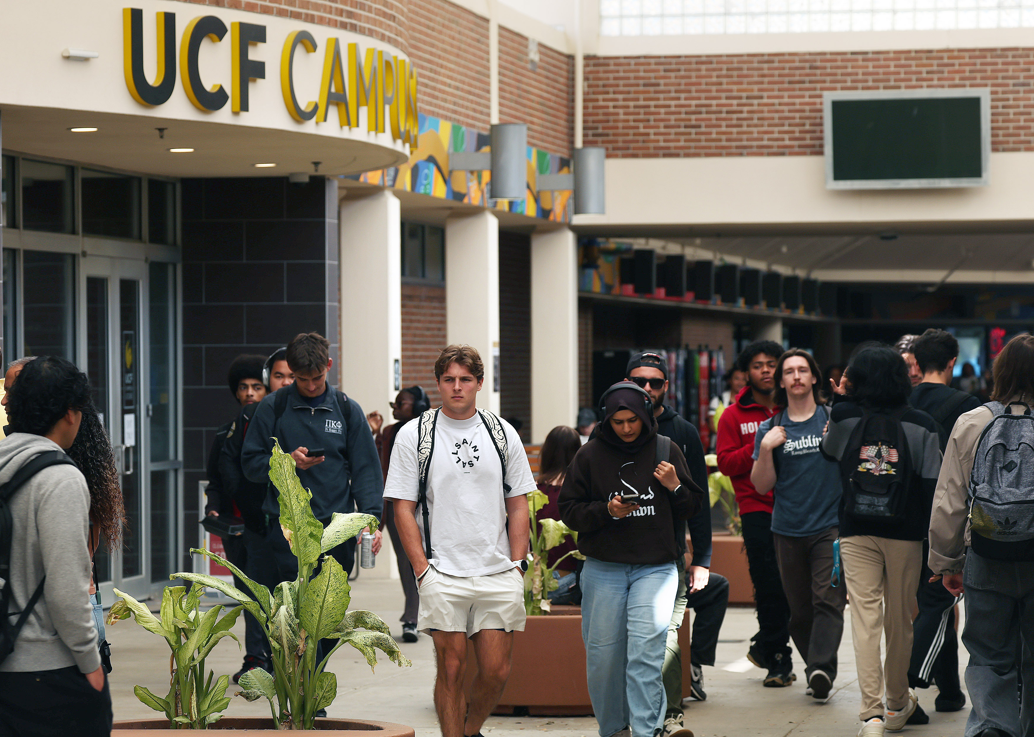 Students walk on the campus of the University of Central Florida on Wednesday, February 4, 2026. A Florida state representative is proposing to cap the percentage of out-of-state students, reducing it to just 5% at UF, FSU, USF and UCF by 2030.