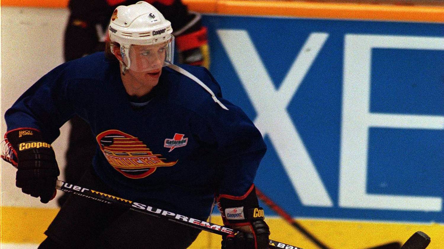 Team World NHL All-Stars Pavel Bure, left, from the Florida Panthers speaks  with his brother Valeri Bure, from the Calgary Flames during their practice  in Toronto Saturday, Feb. 5, 2000. Team World