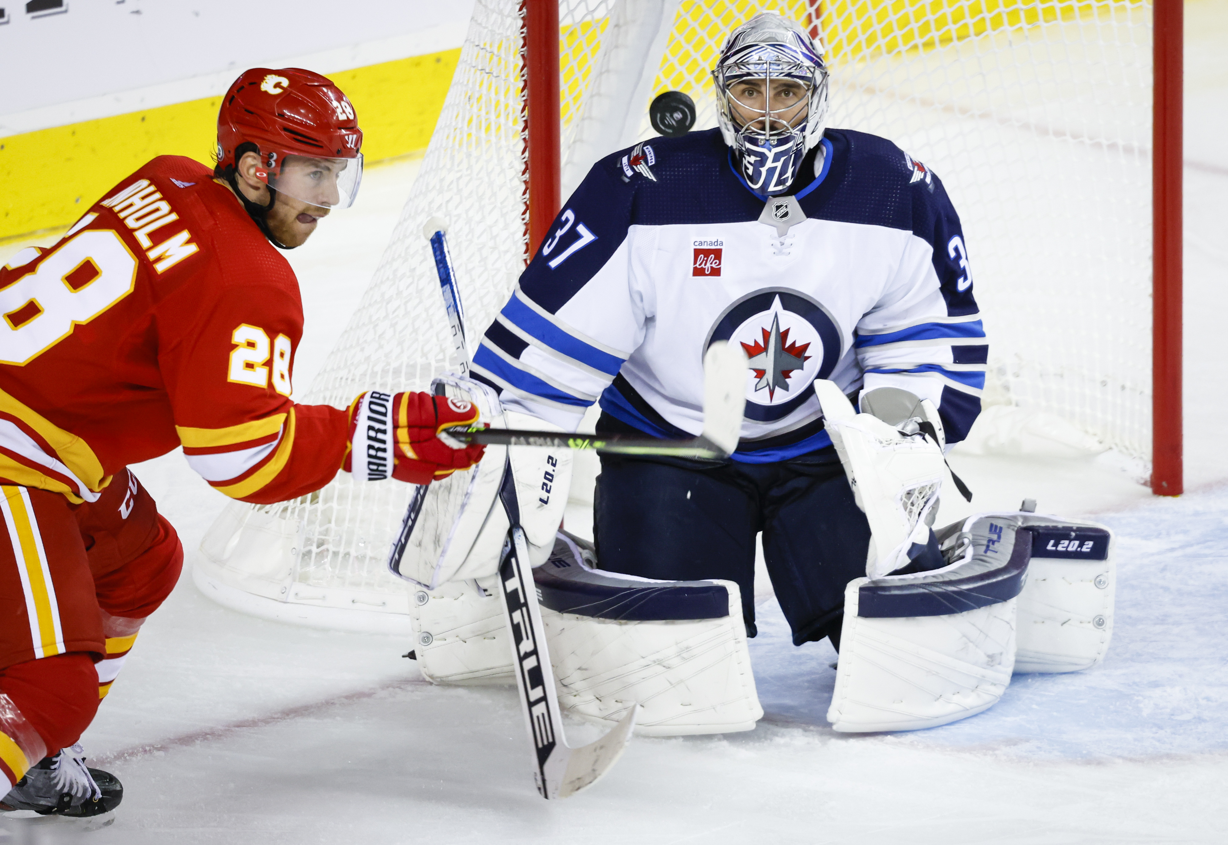 Winnipeg Jets preseason vs. Calgary Flames tonight, Connor Hellebuyck  starts in goal 