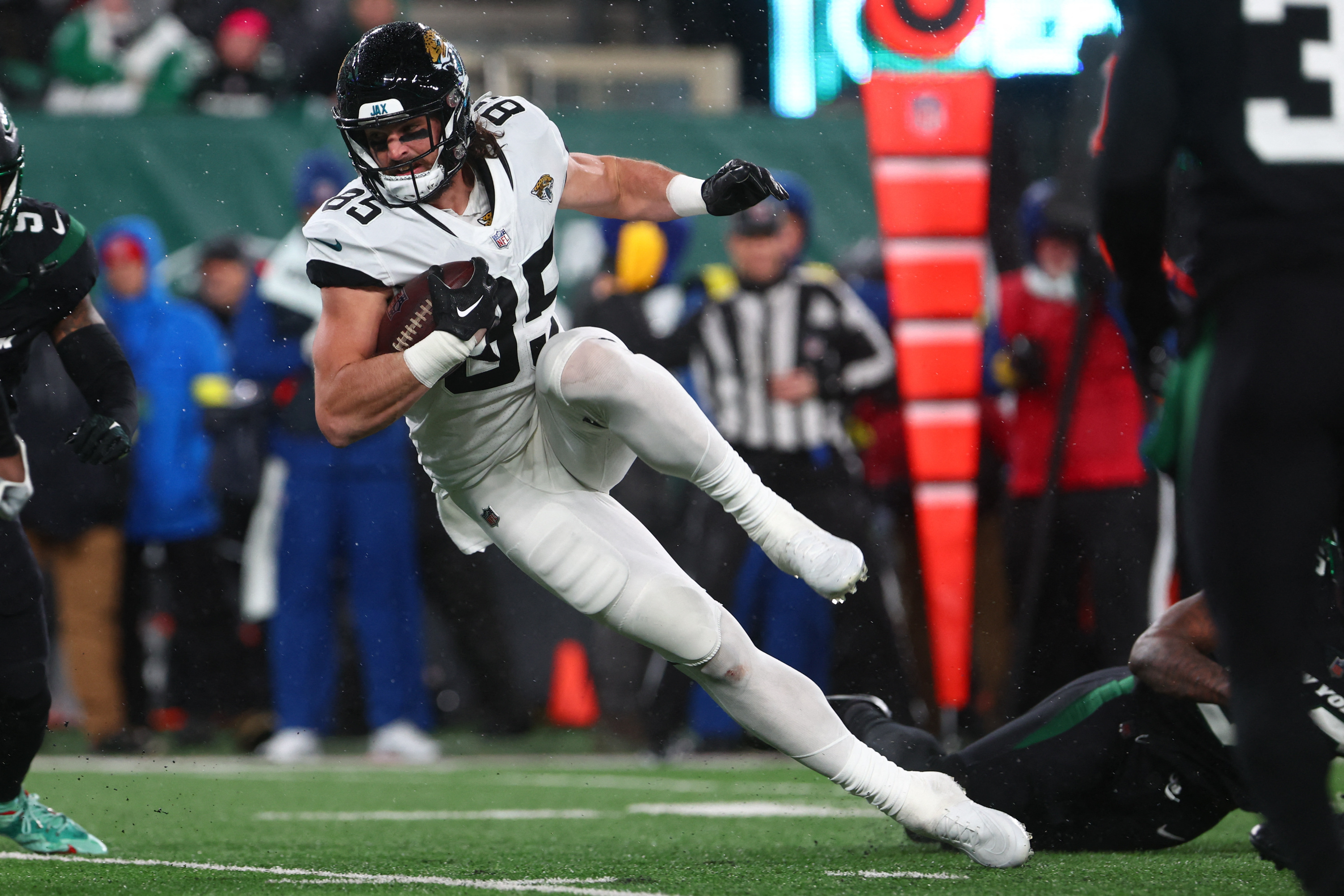 EAST RUTHERFORD, NJ - DECEMBER 26: Jacksonville Jaguars quarterback Trevor  Lawrence (16) comes off the field during the National Football League game  between the New York Jets and the Jacksonville Jaguars on