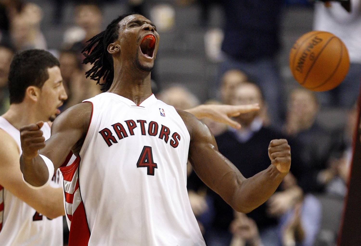 Toronto Raptors' Chris Bosh reacts during the fourth quarter of