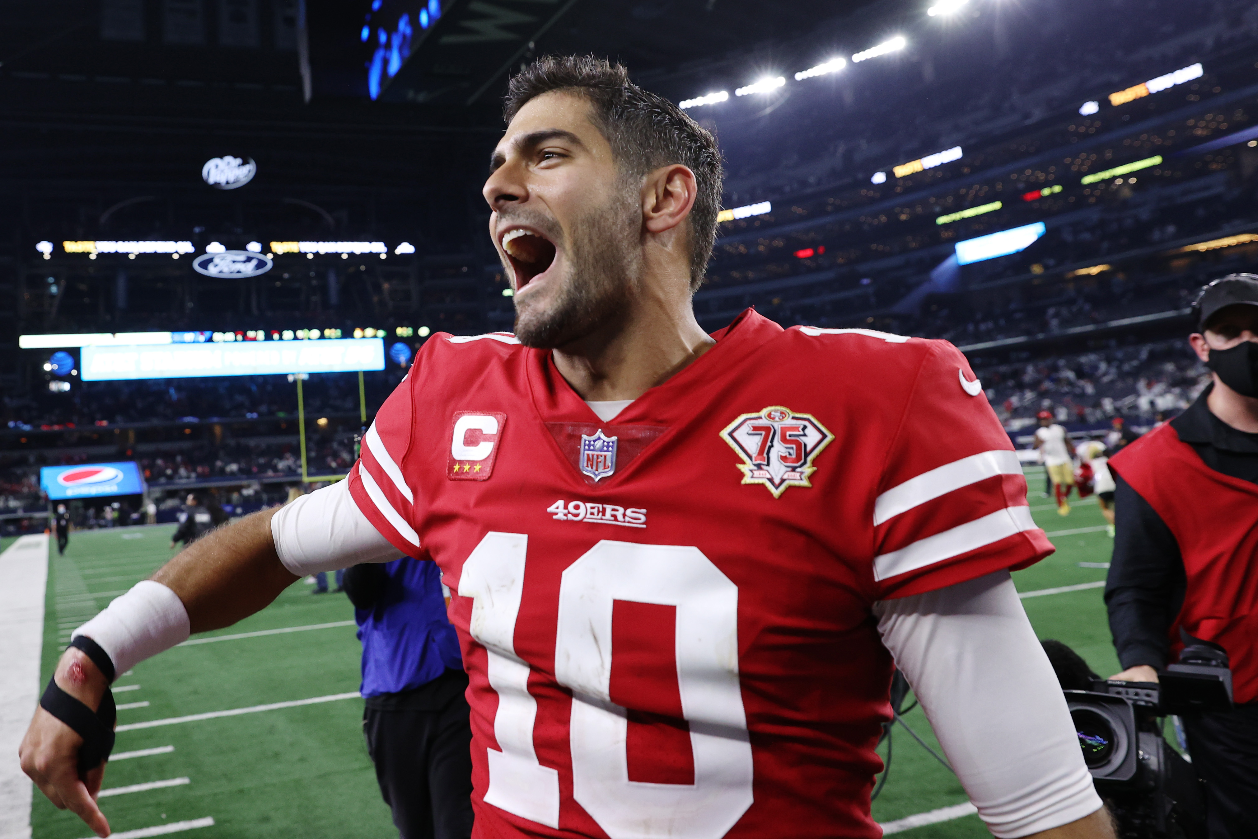 San Francisco 49ers quarterback Jimmy Garoppolo (10) is seen on the  sidelines during a wild card NFL football game against the Dallas Cowboys,  Sunday, Jan. 16, 2022, in Arlington, Texas. San Francisco