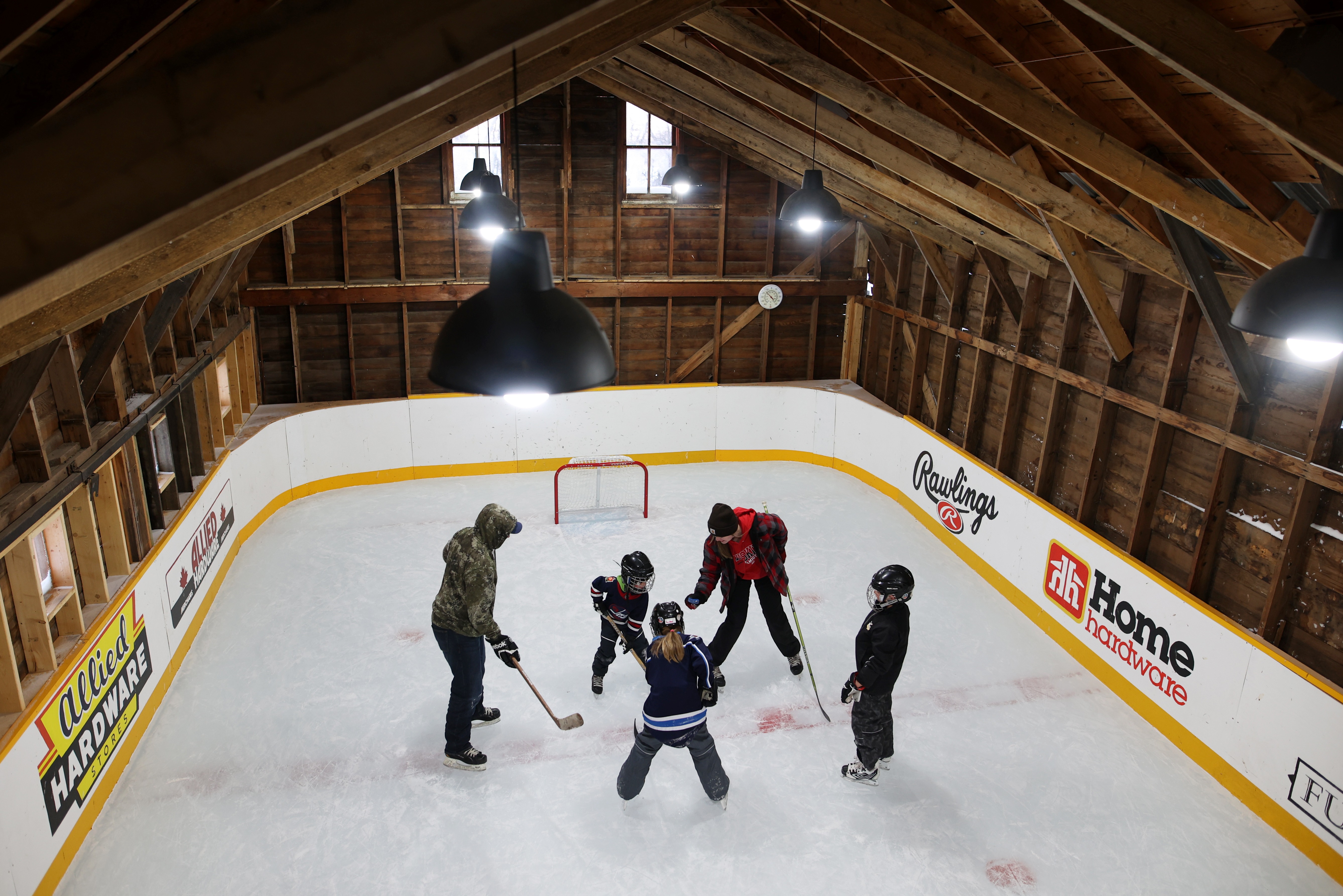 In a sheep barn turned hockey arena, a Manitoba family and friends make their own kind of farm team