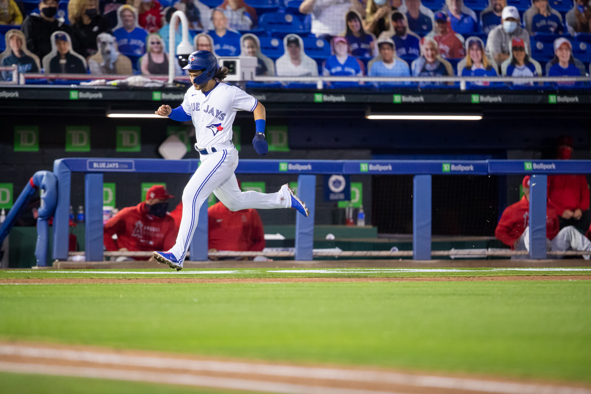 Bo Bichette of the Toronto Blue Jays smiles as he jogs off the