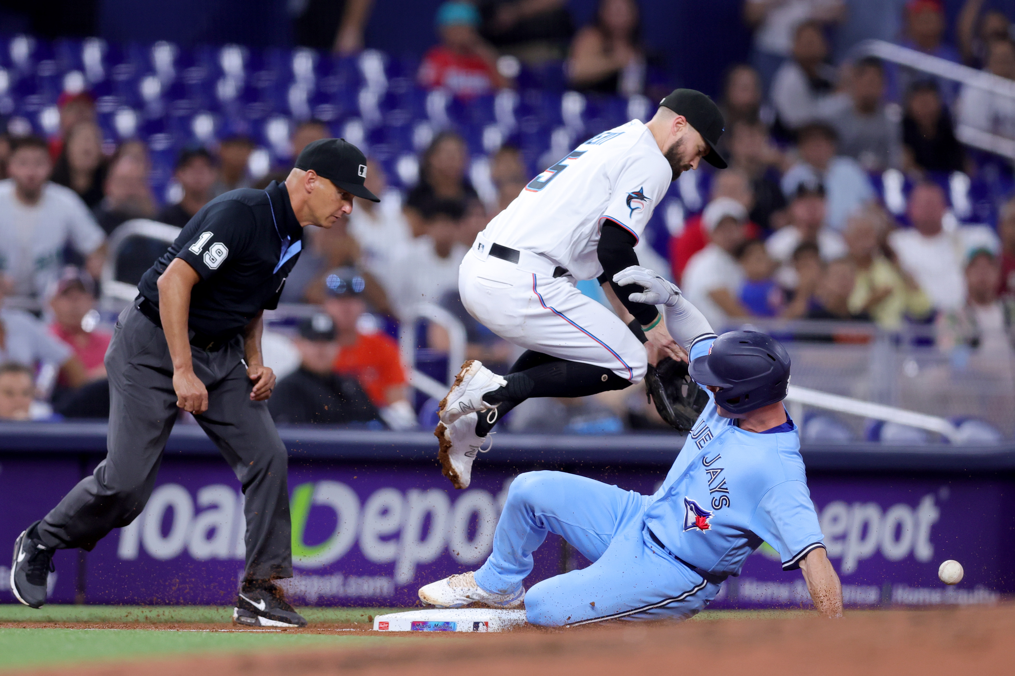 Clement and Springer hit RBI singles in the 8th in the Blue Jays' 2-0 win  over the Marlins