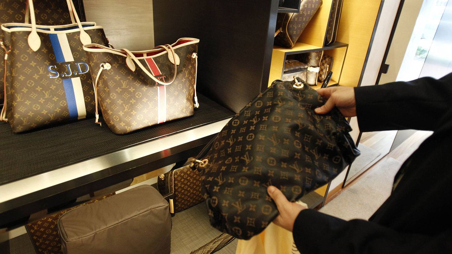 Bags by Chanel and Gucci and shoes by Louis Vuitton: RBC Europe