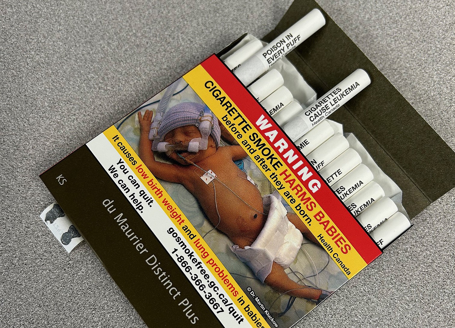 Cigarettes with health warnings could nudge smokers to butt out