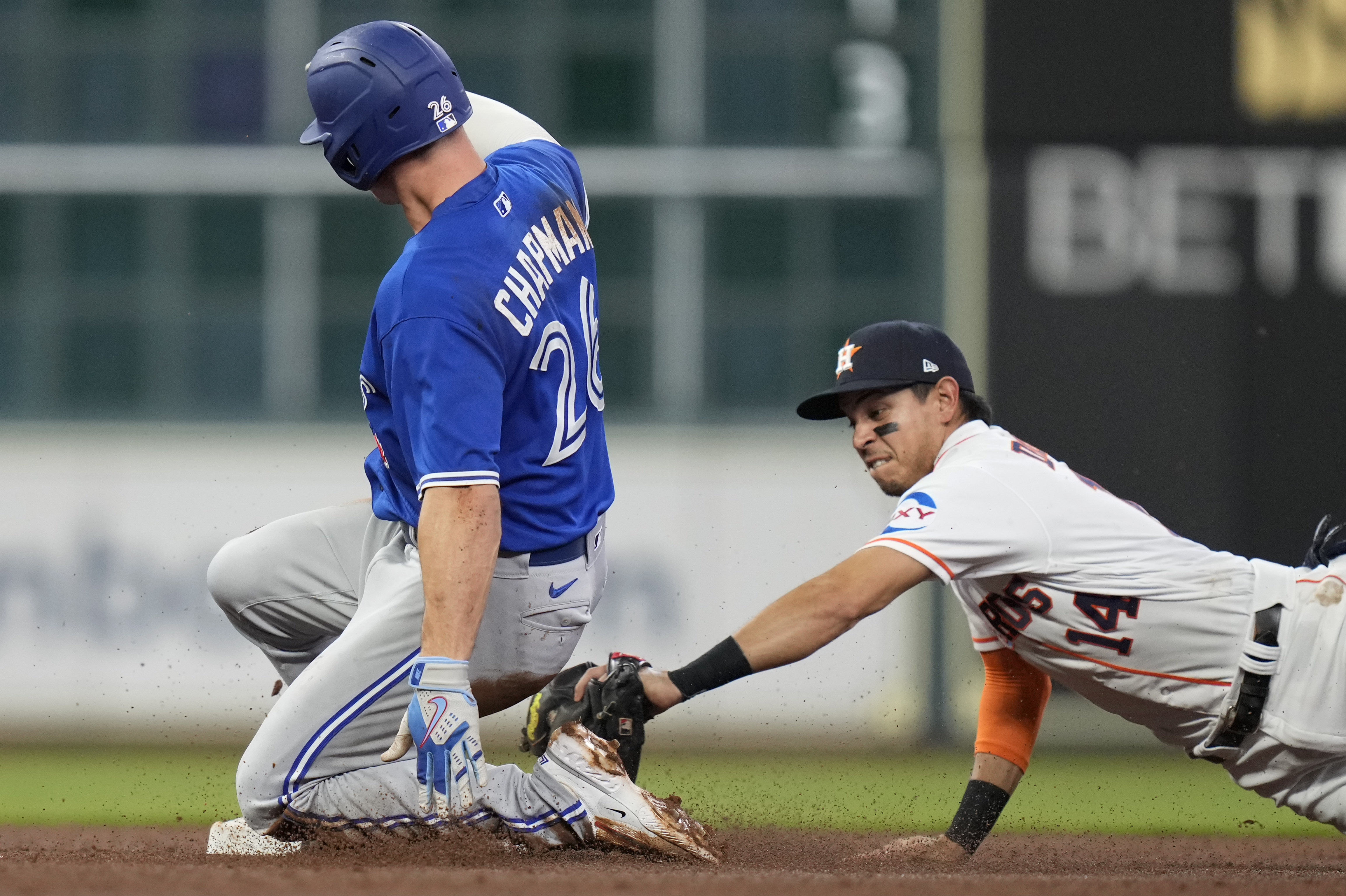 Toronto Blue Jays' Matt Chapman (26) follows through on a home run