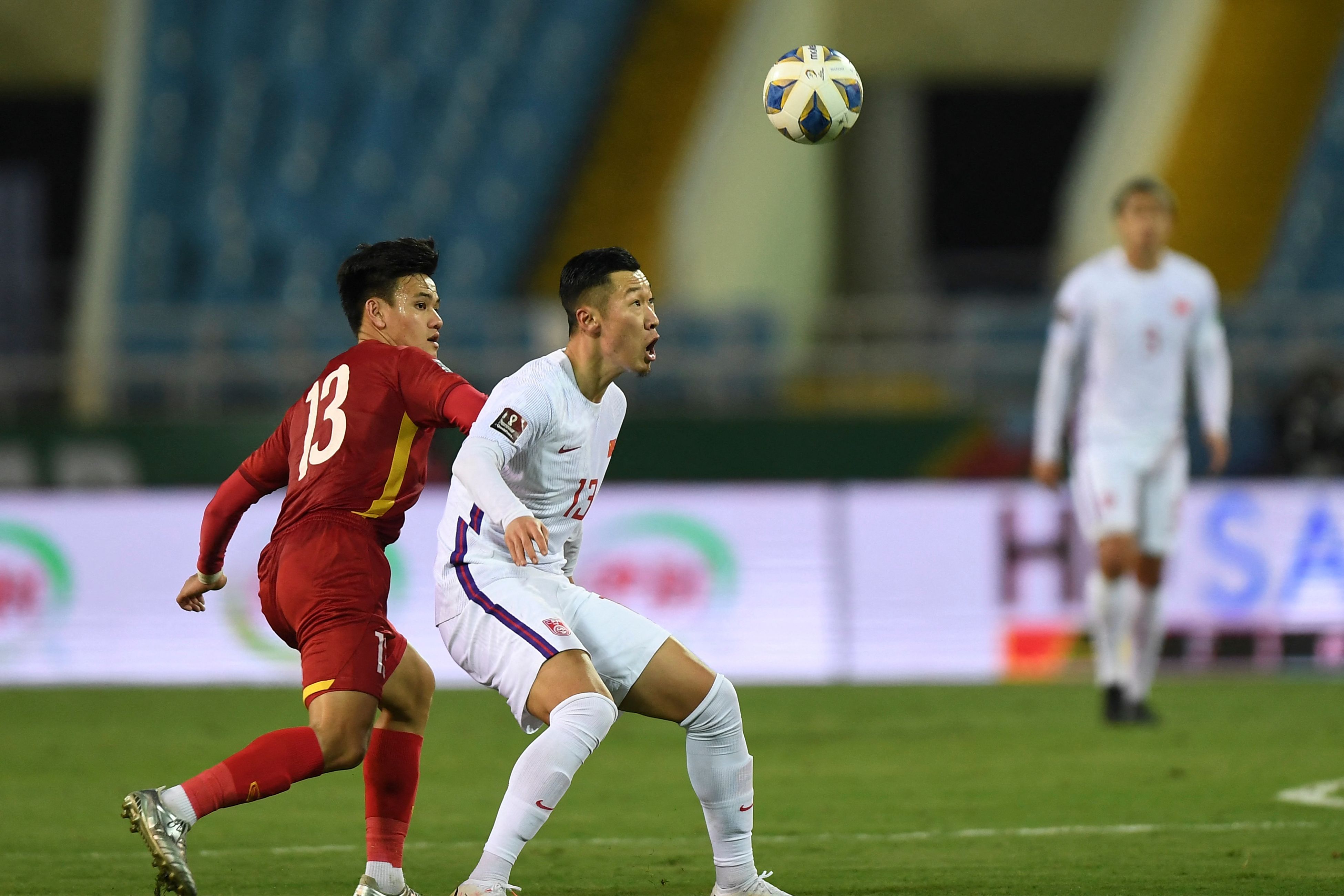 Short Pants and Long Sleeves: China's Soccer Team Plays Under