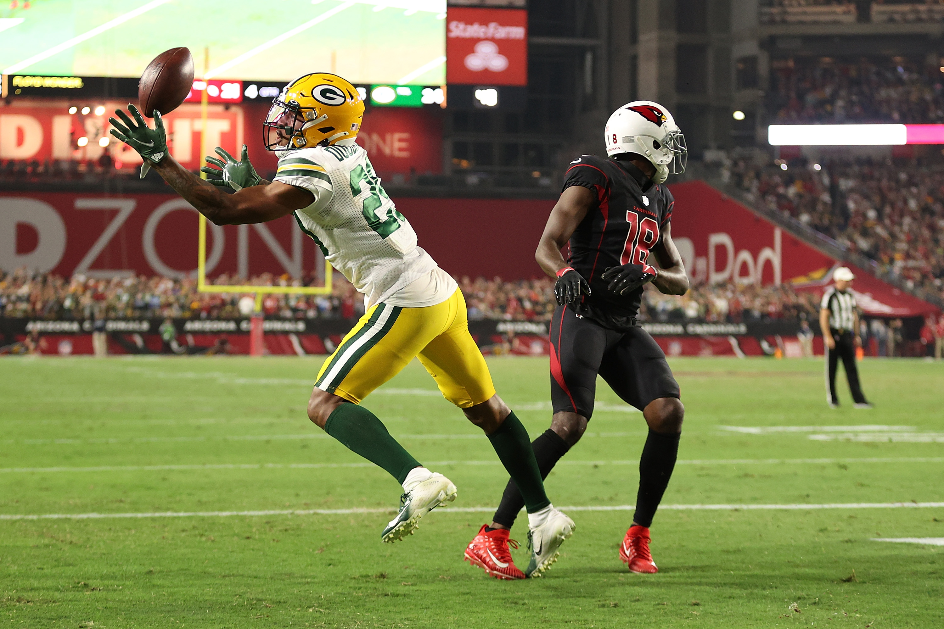 Quarterback (12) Aaron Rogers of the Green Bay Packers drops back to pass  against the Arizona Cardinals in an NFL football game, Thursday, Oct. 28,  2021, in Glendale, Ariz. The Packers won