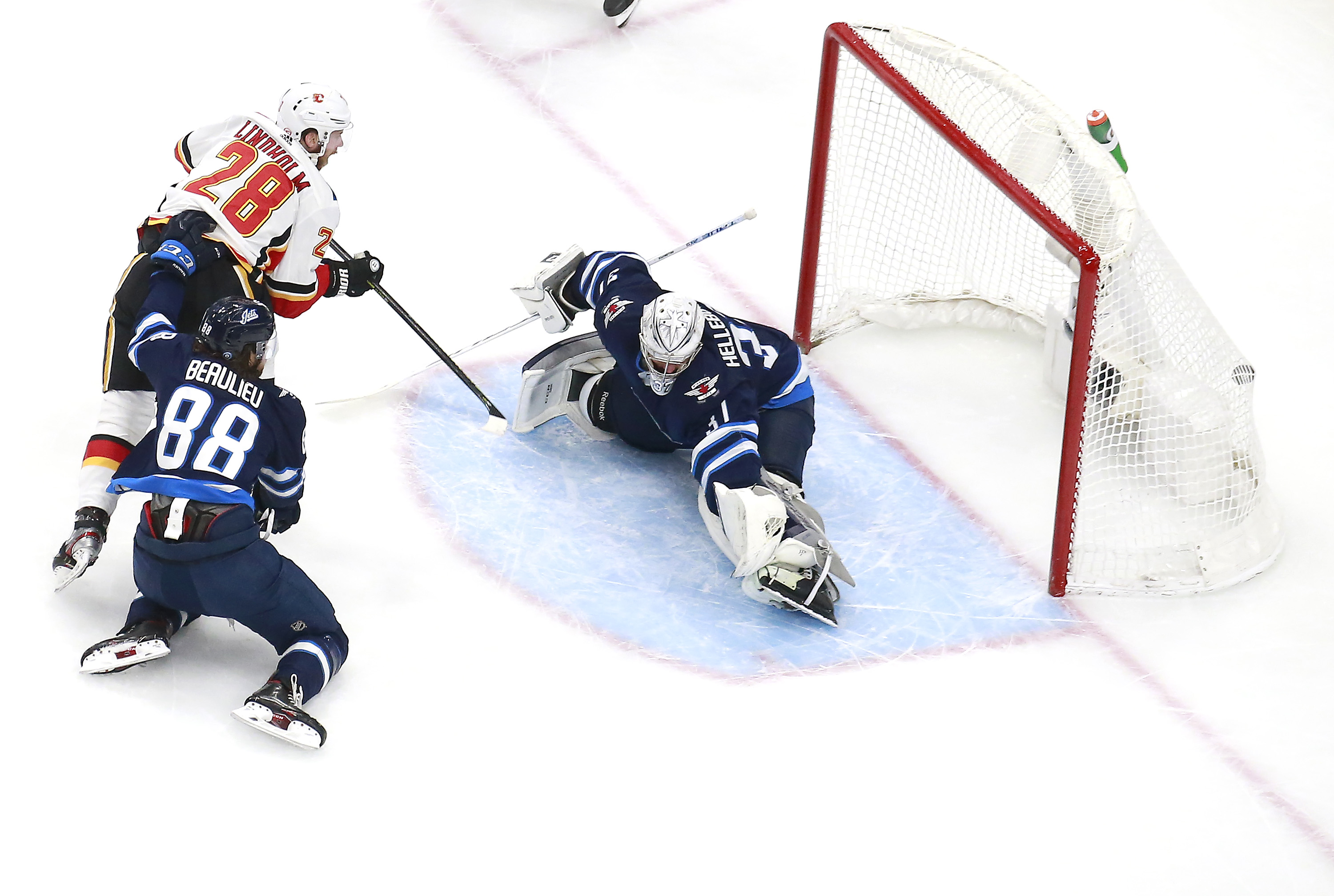 Mark Scheifele injured as Flames beat Jets 4-1 in first game of qualifying  series - The Globe and Mail