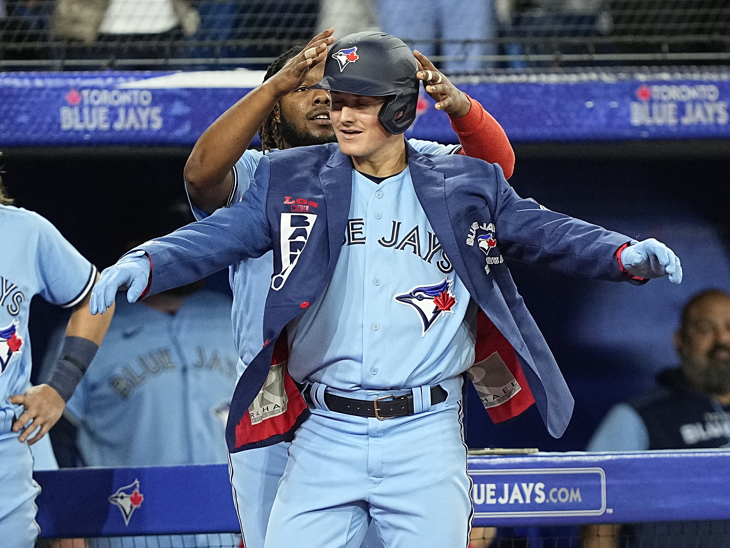 July 1, 2022, Toronto, ON, Canada: Toronto Blue Jays' Lourdes Gurriel Jr  has the home run jacket put on him by Vladimir Guerrero Jr after hitting a  solo home run in off