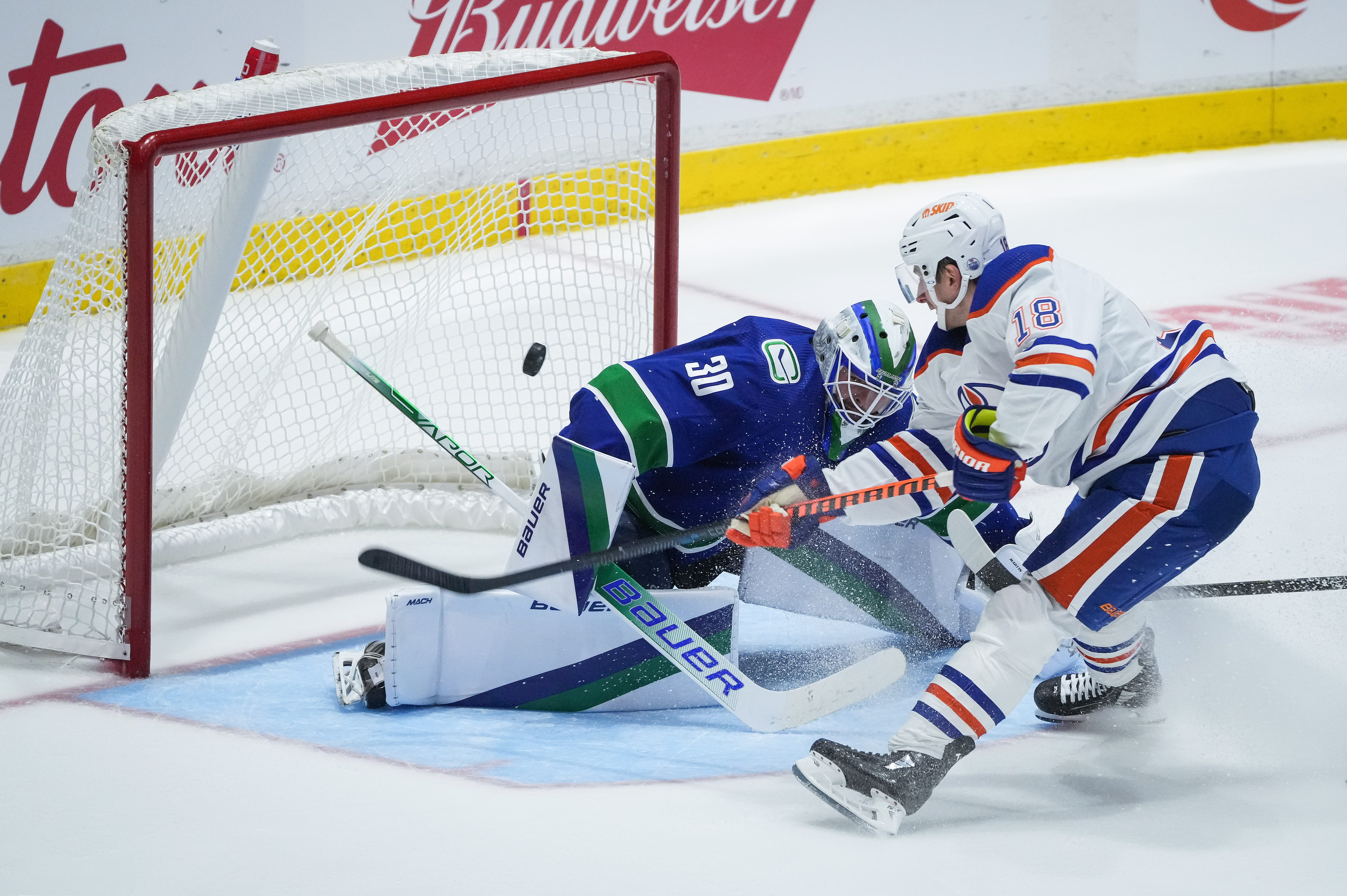 Pettersson scores twice, Canucks edge Oilers for first win of the