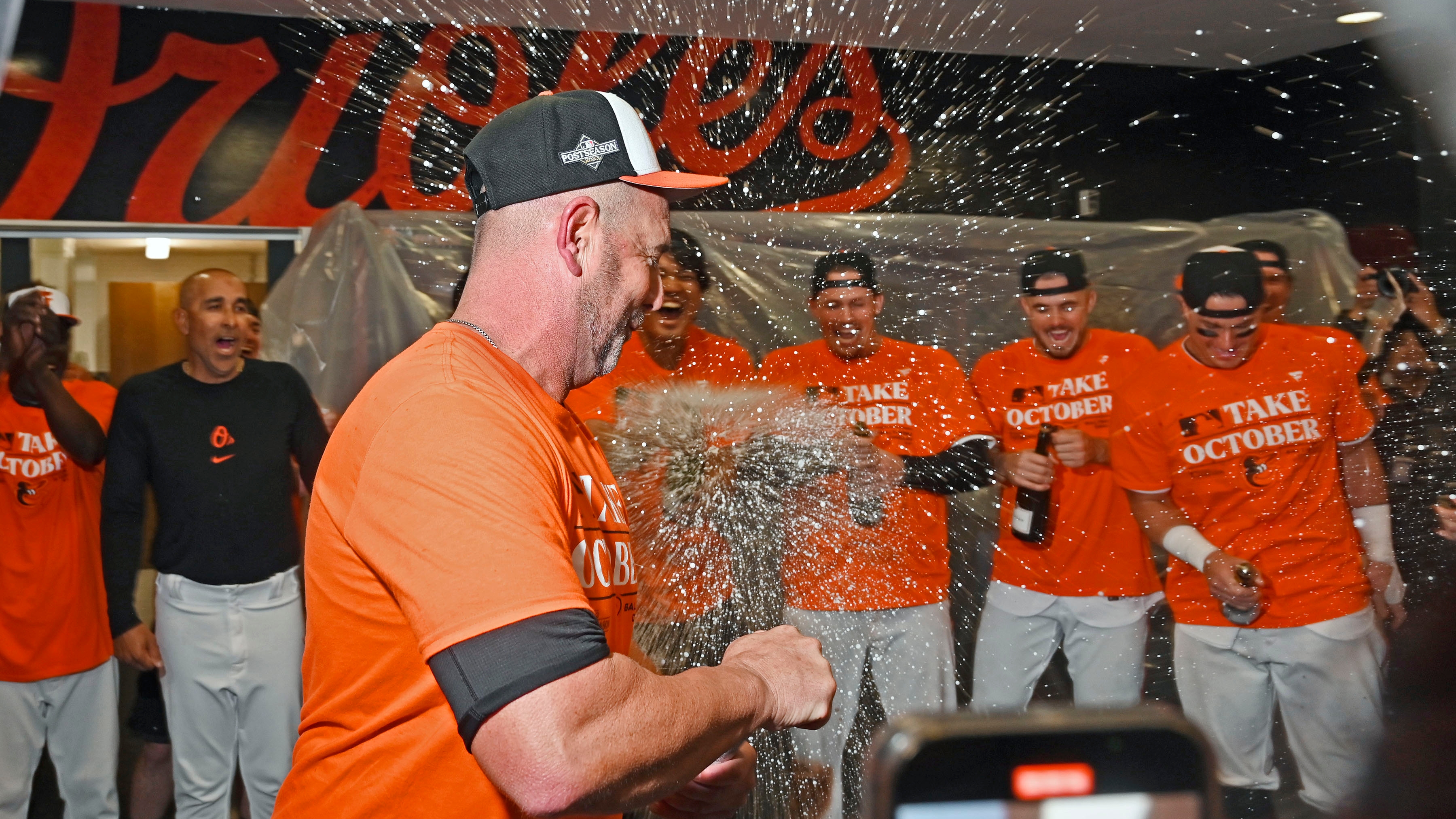 Inside the Orioles' playoff-clinching clubhouse celebration, from a laundry  cart shower to cork collecting