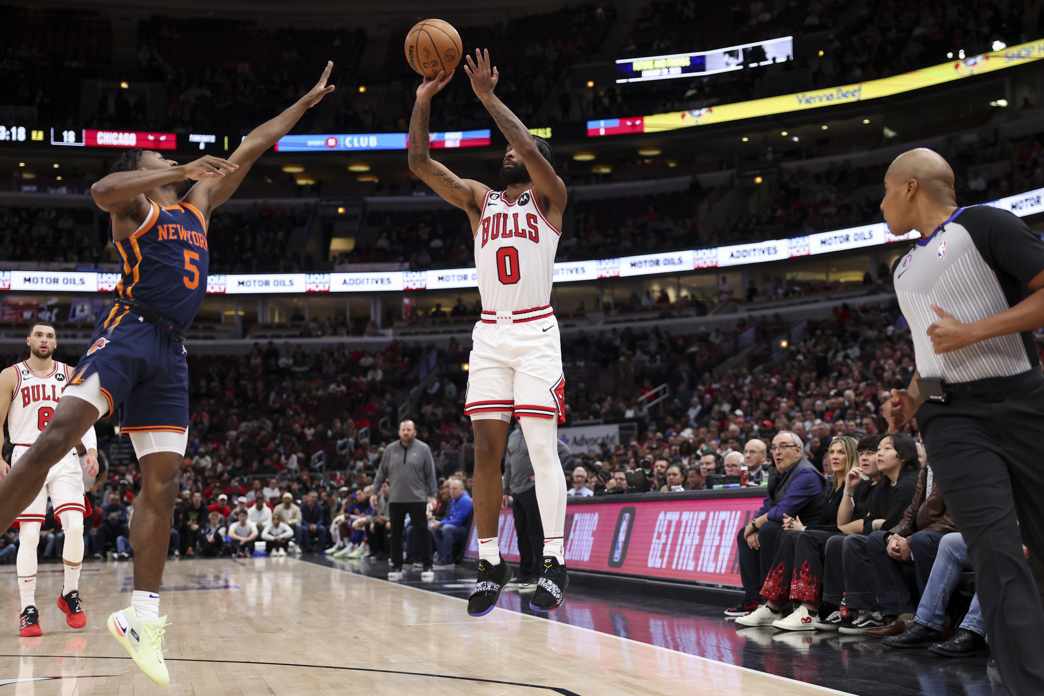 Chicago Bulls' DeMar DeRozan scores over New York Knicks' Jalen Brunson  during the second half of an NBA basketball game Wednesday, Dec. 14, 2022,  in Chicago. The Knicks won in overtime 128-120. (