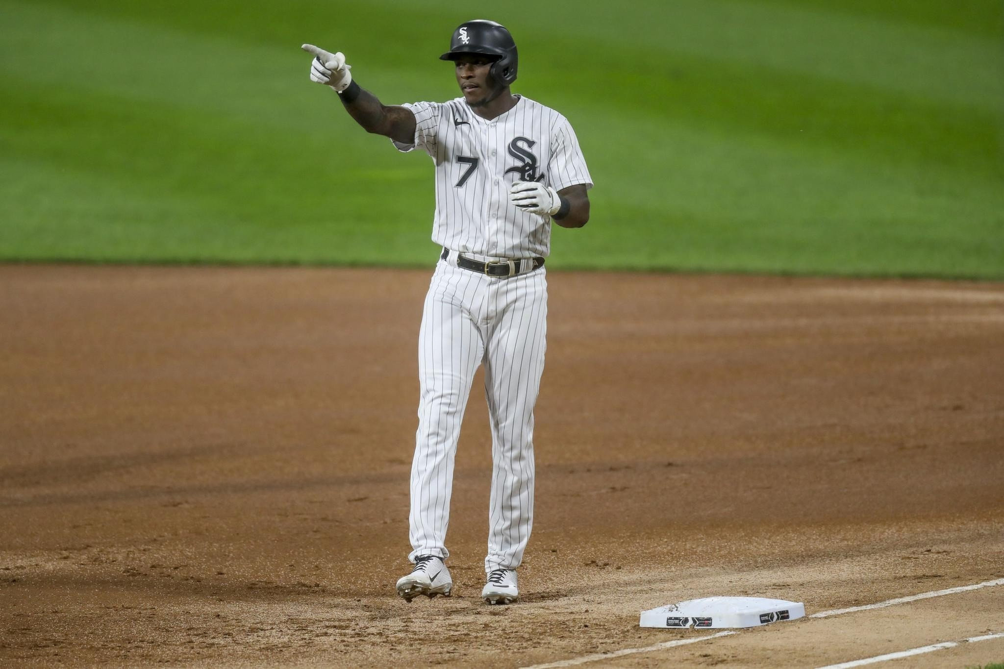 Chicago White Sox shortstop Tim Anderson, left, and Jose Abreu sit together  in the dugout during a baseball game against the Chicago Cubs Friday, Aug.  6, 2021, in Chicago. (AP Photo/Charles Rex