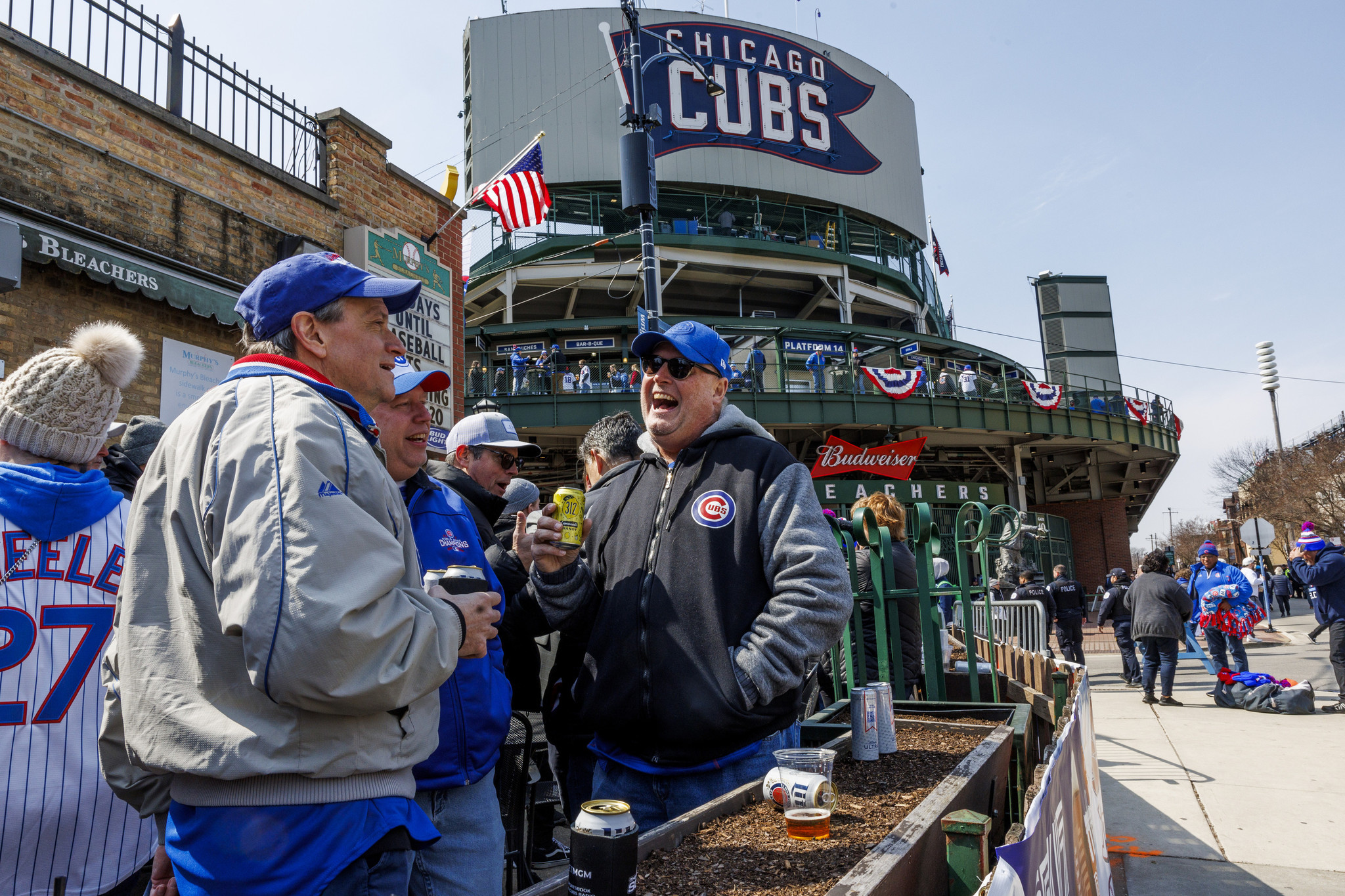 Chicago Tribune - Fans gather near the Wrigley Field marquee on