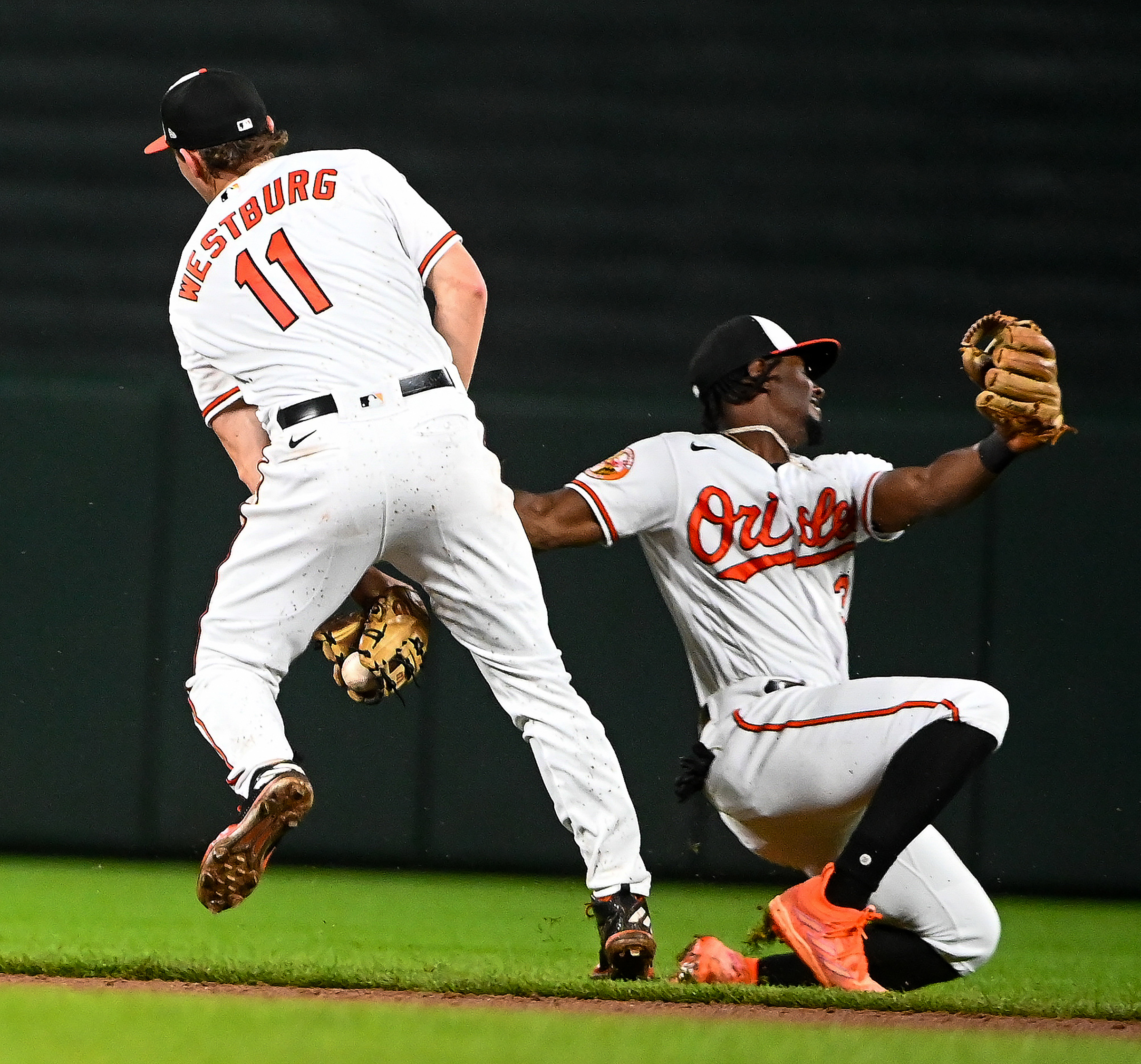 Baltimore Orioles' Jorge Mateo, left, is embraced by Ramon Urias