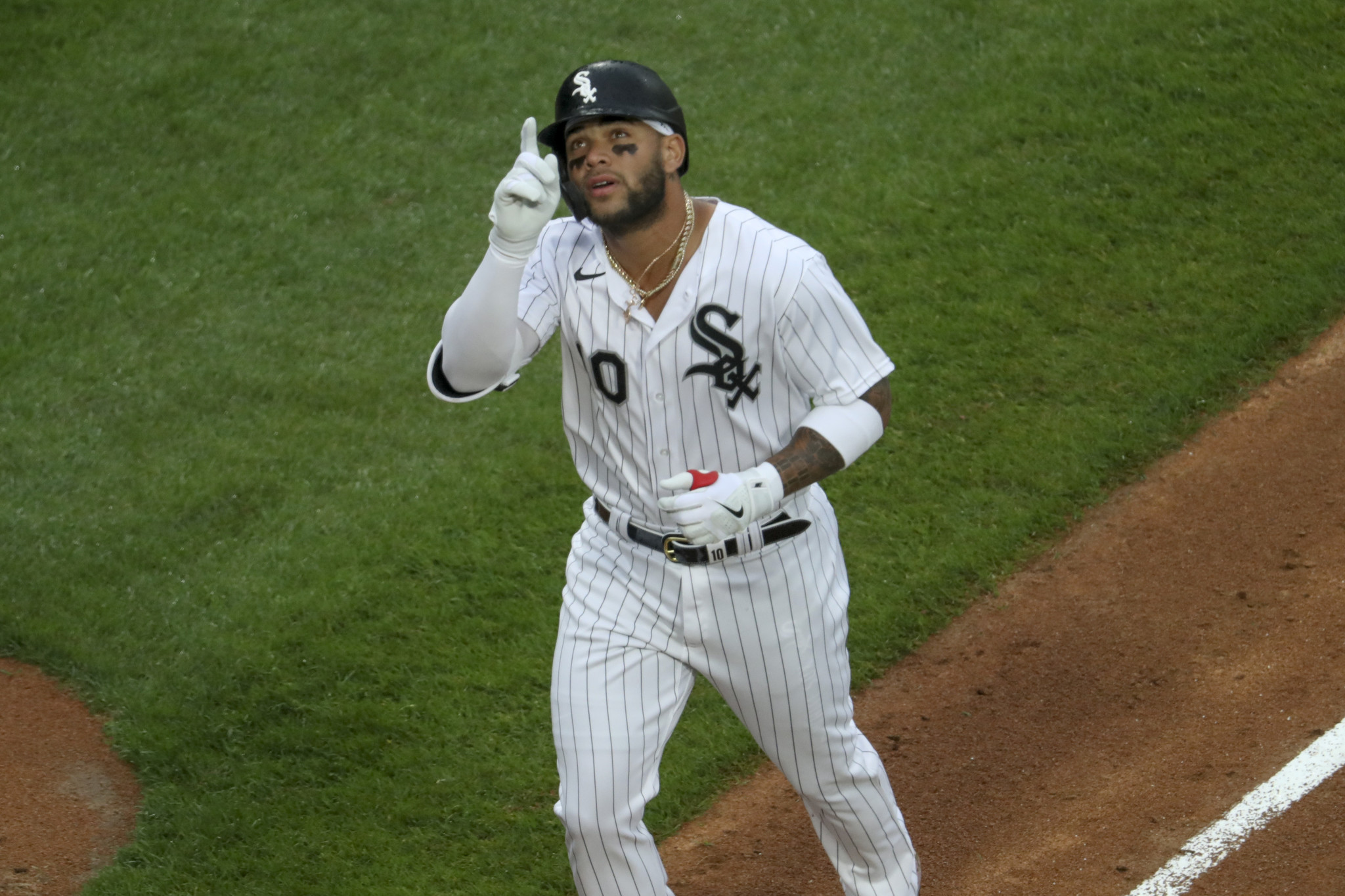 Chicago White Sox's Yoan Moncada heads to first base after being