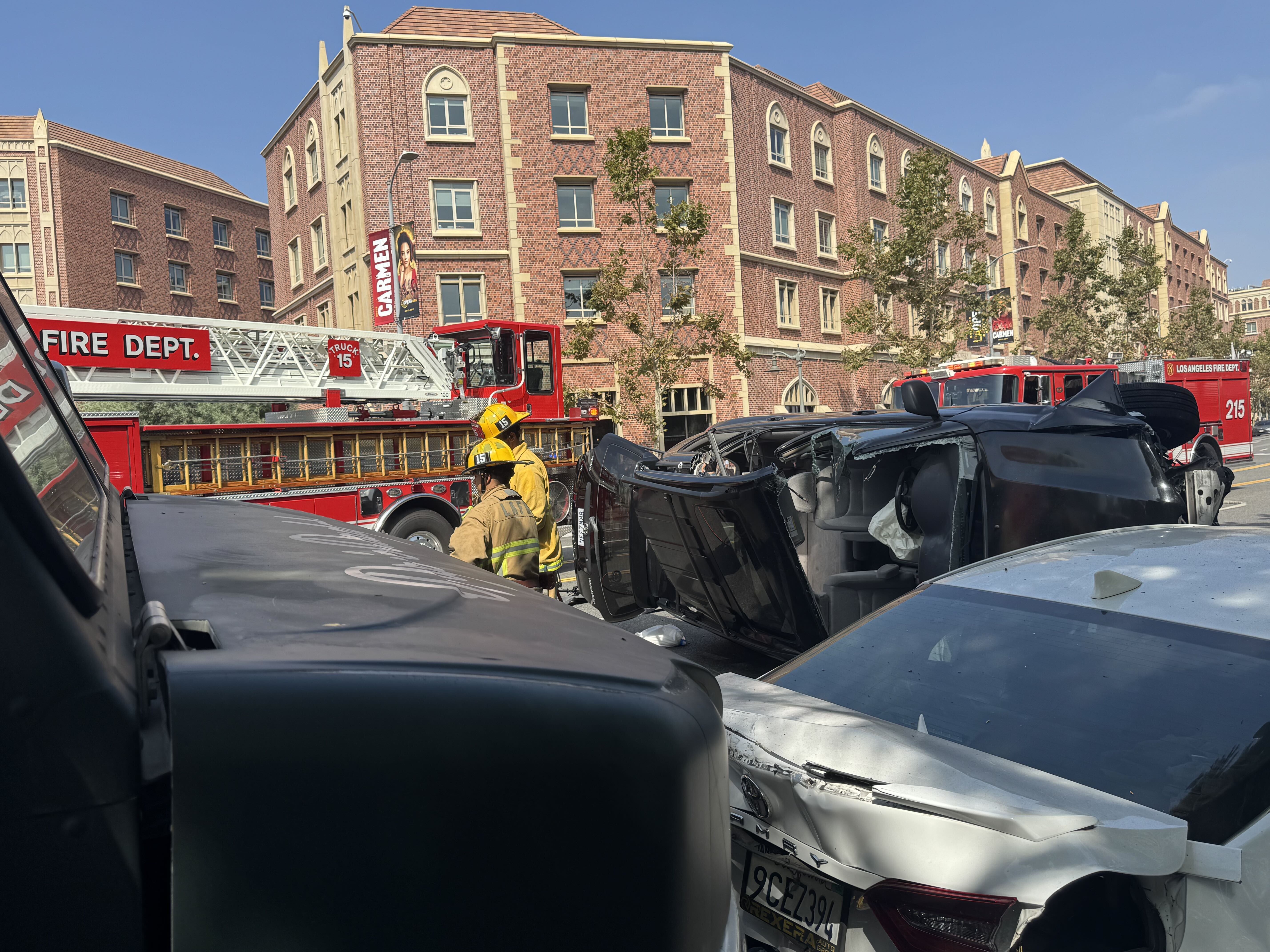 Driver injured after crashing into parked car and overturning near USC Village