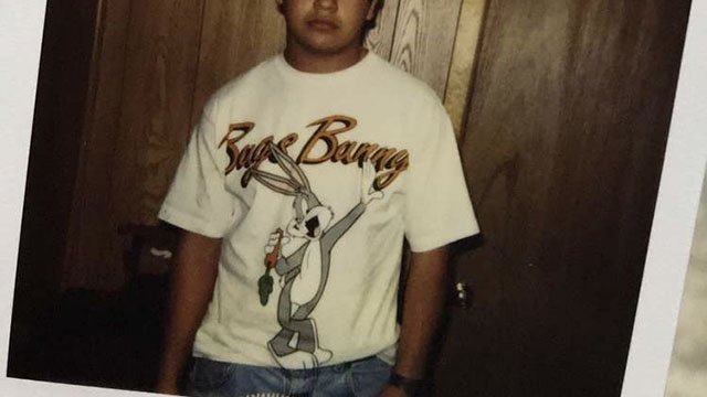 Scan of a poloroid photo of a young person in a Bugs Bunny tshirt.