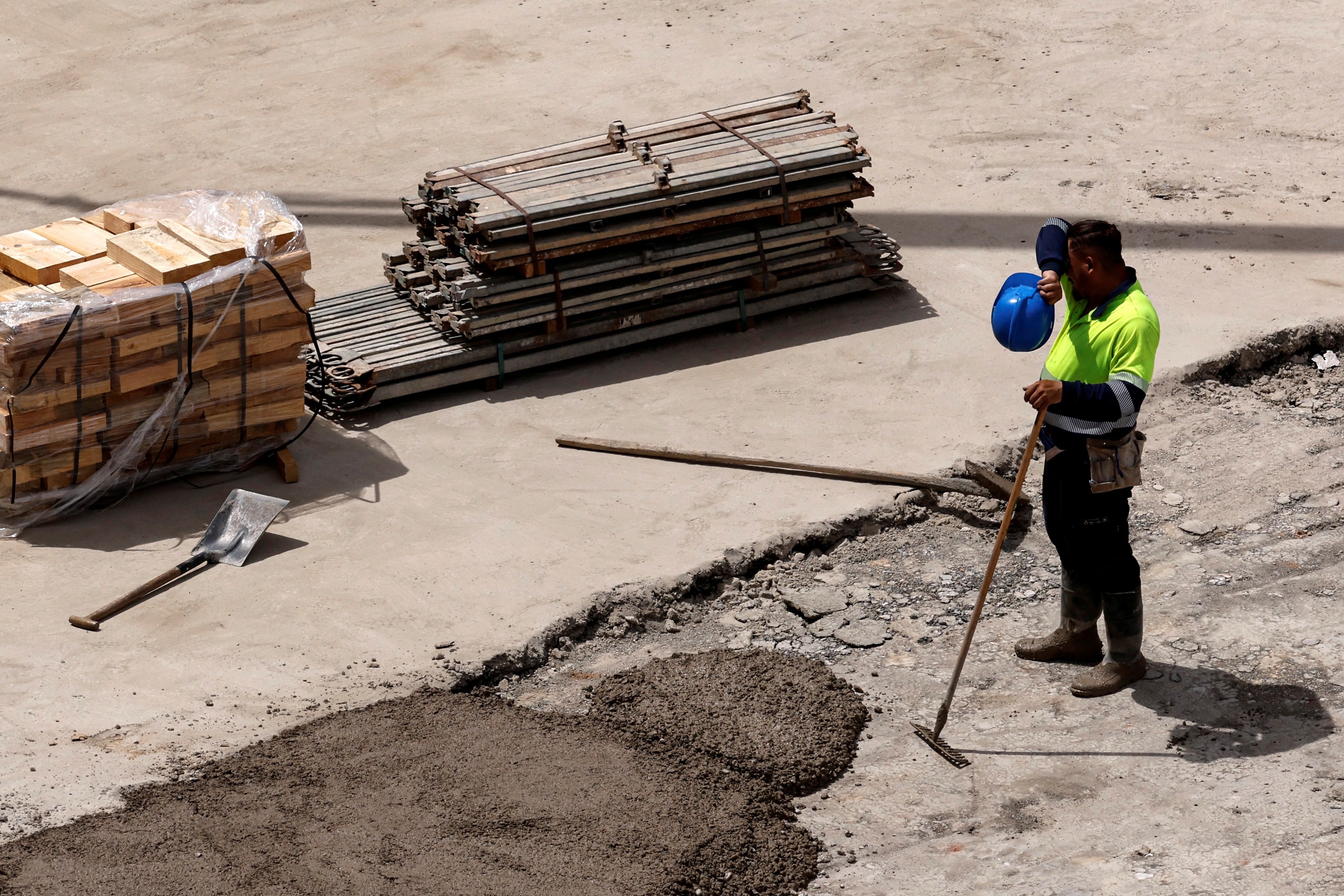 A worker at a road construction site in Madrid on Monday, during Europe's record heat wave this week. (Oscar Del Pozo/AFP/Getty Images)