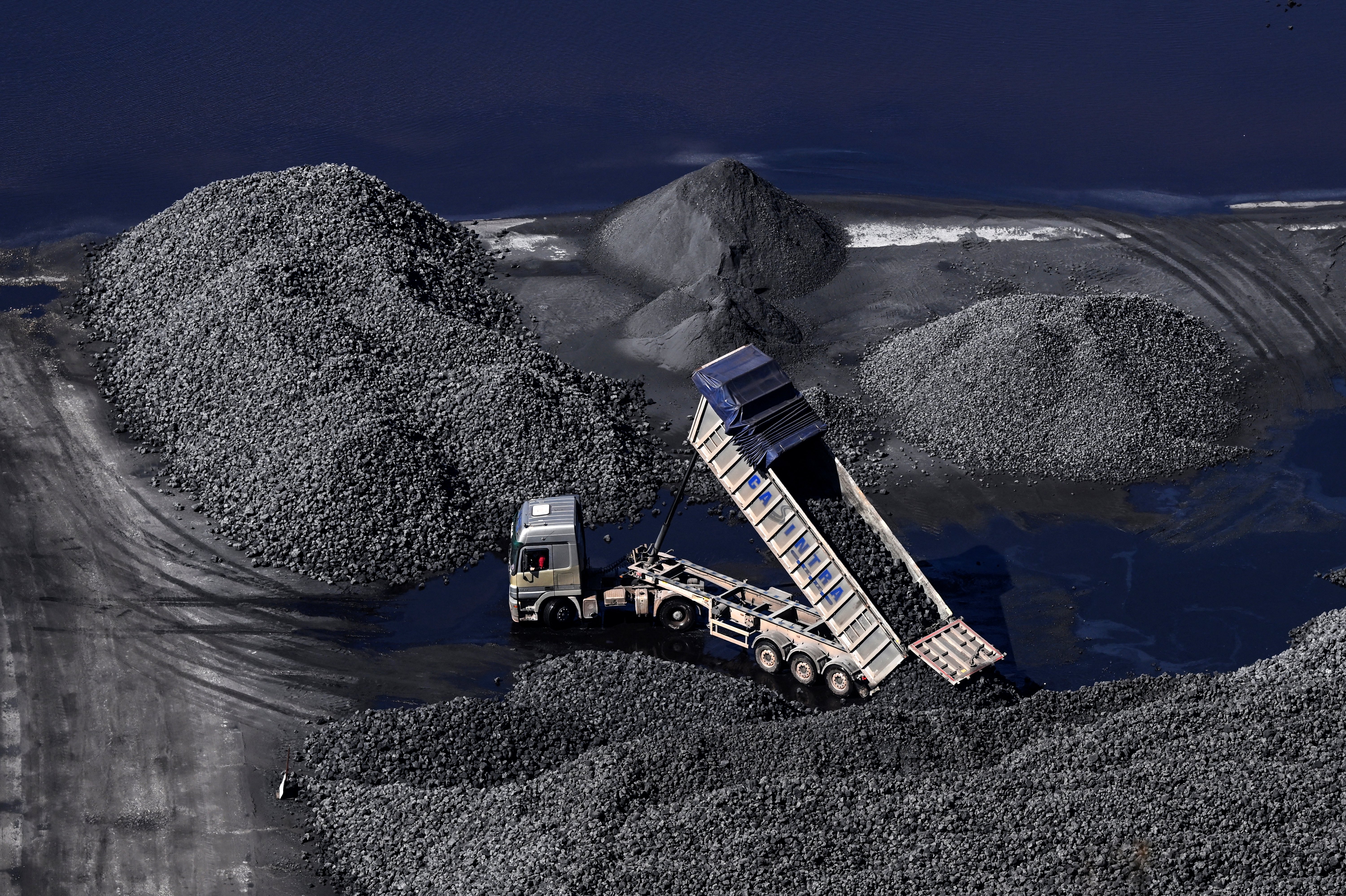 A truck loads coal at the Aboño Thermal Power Station in Gijón, Spain, last month. The war in Iran has upended global energy markets. (Ander Gillenea/AFP/Getty Images)
