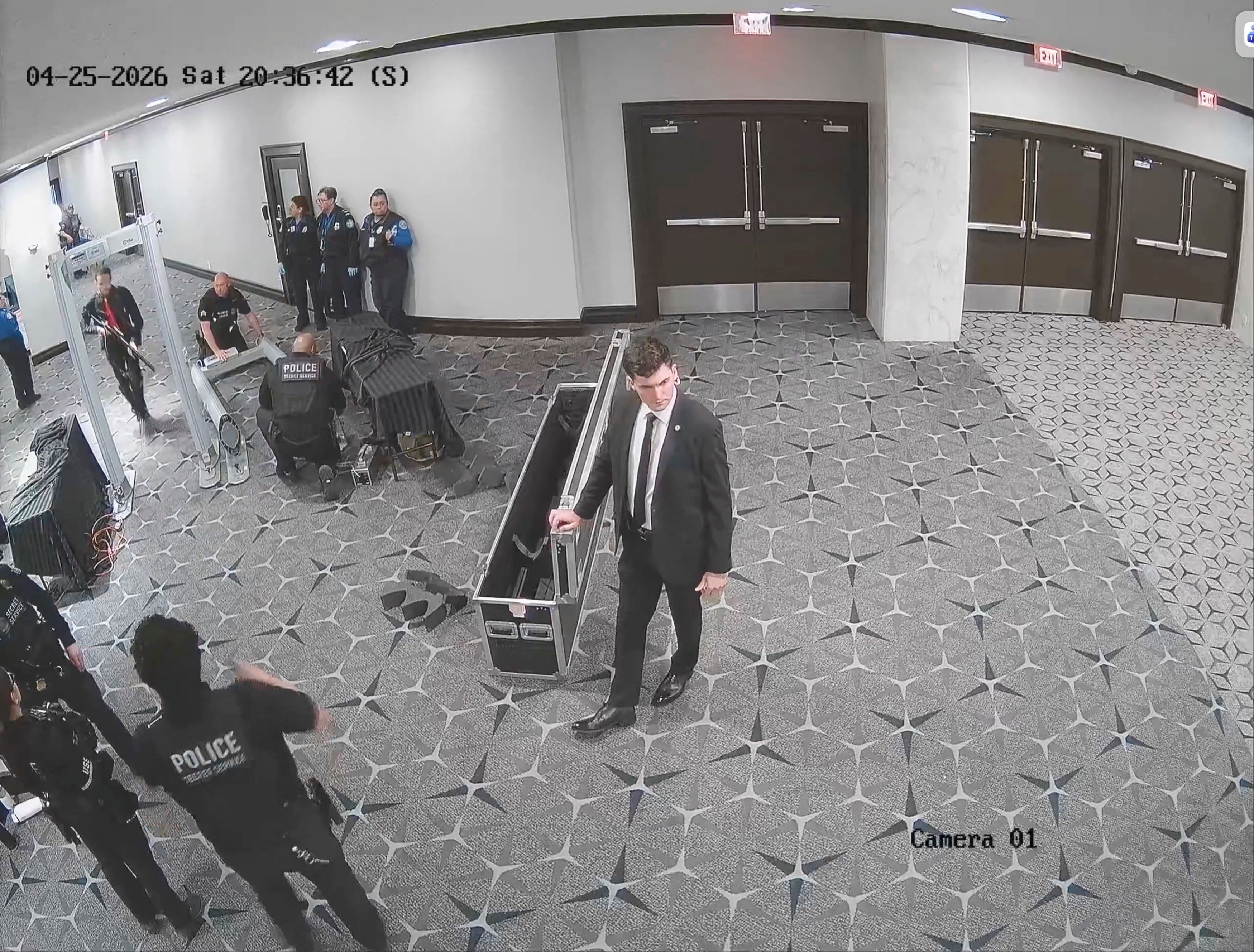 A screenshot taken from a security camera video and obtained by The Washington Post shows the moment the suspected gunman ran through the magnetometers on the terrace floor of the Washington Hilton hotel on April 25. (U.S. Attorney Jeanine Pirro/X/Reuters)