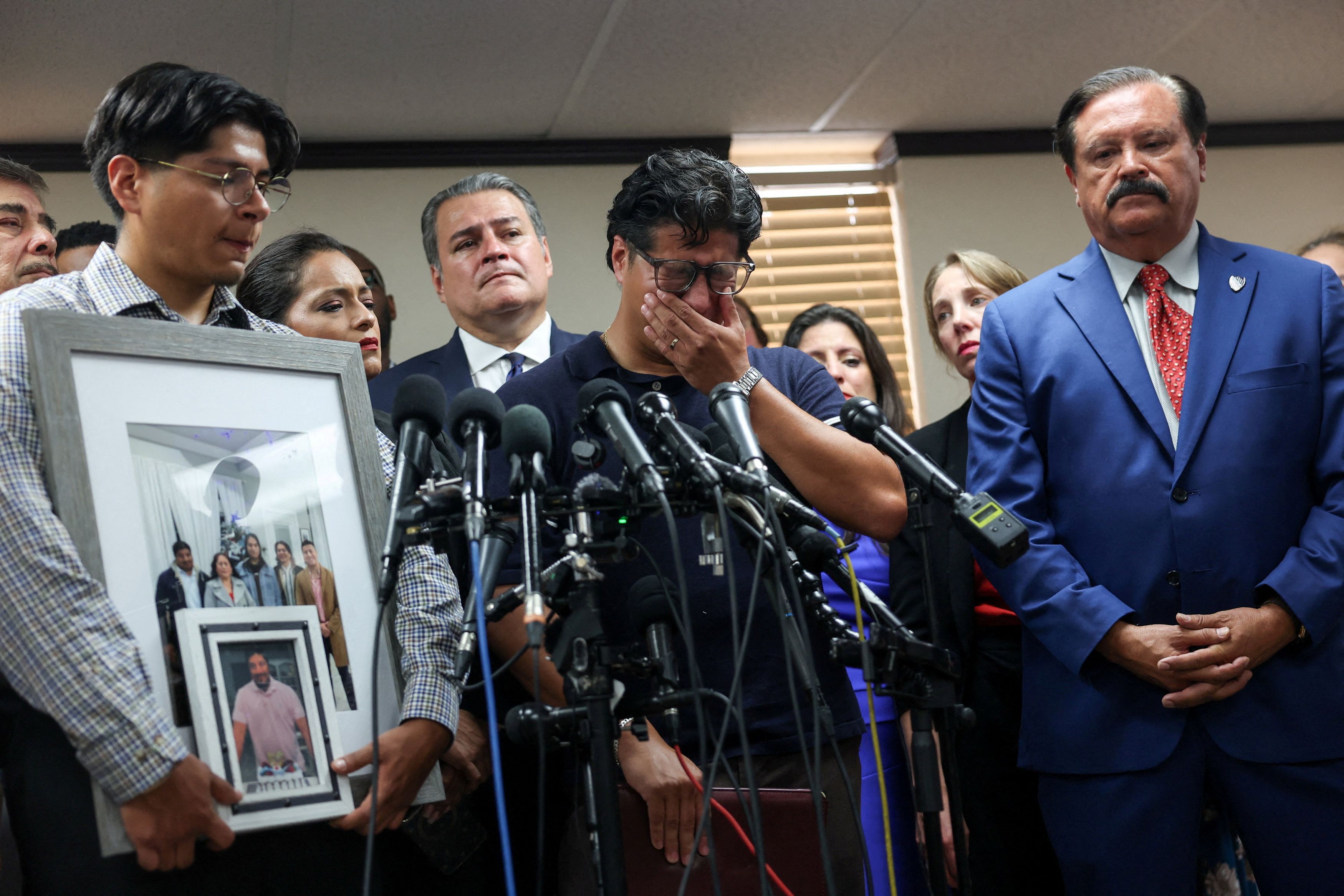 Ronaldo Salgado sobs during a news conference on Wednesday after an ICE agent fatally shot his father in Houston. (Antranik Tavitian/Reuters)