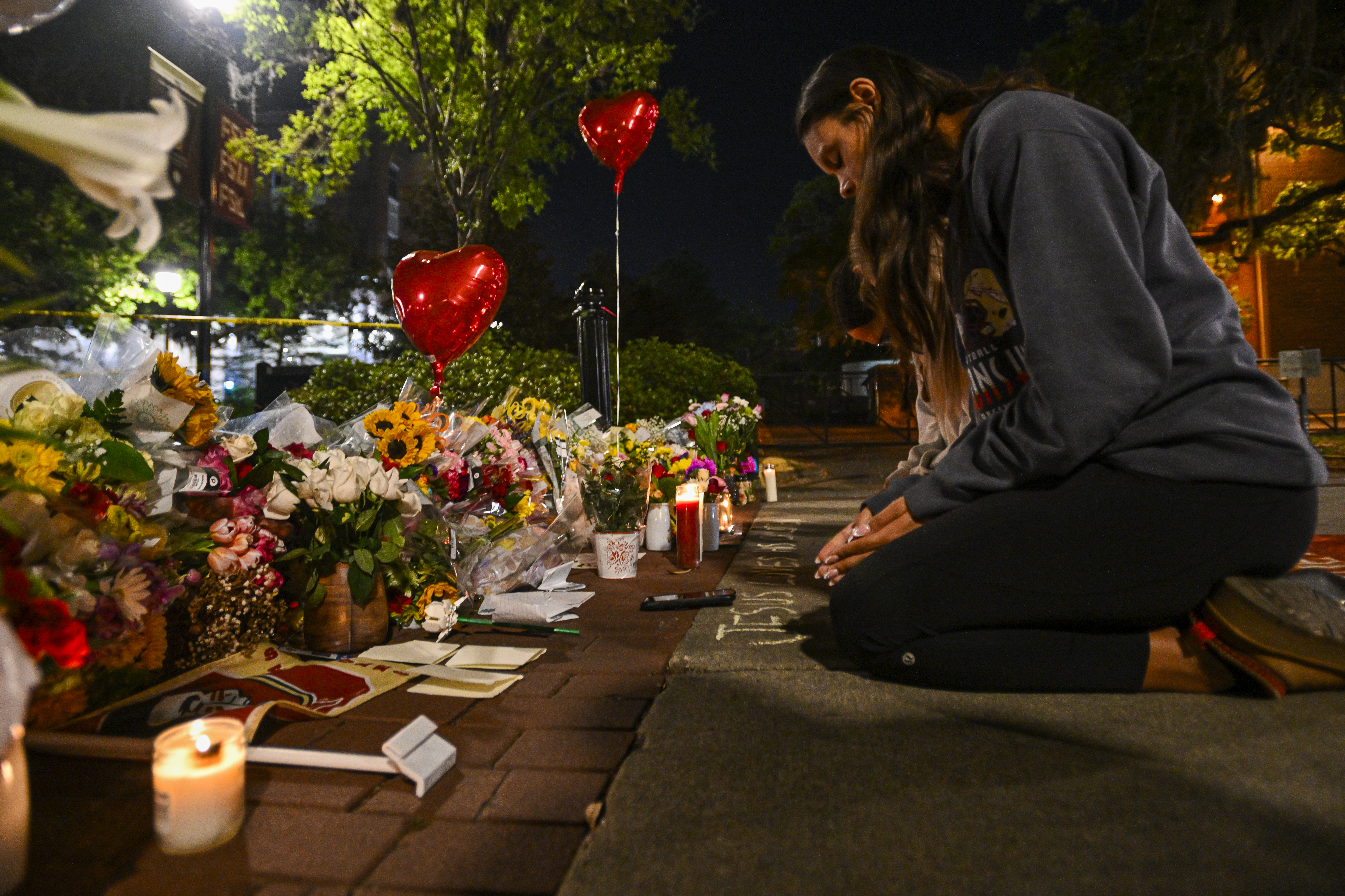 Students hold a vigil near the scene of a shooting on the Florida State University campus in Tallahassee on April 17, 2025. (Miguel J. Rodriguez Carrillo/Getty Images)