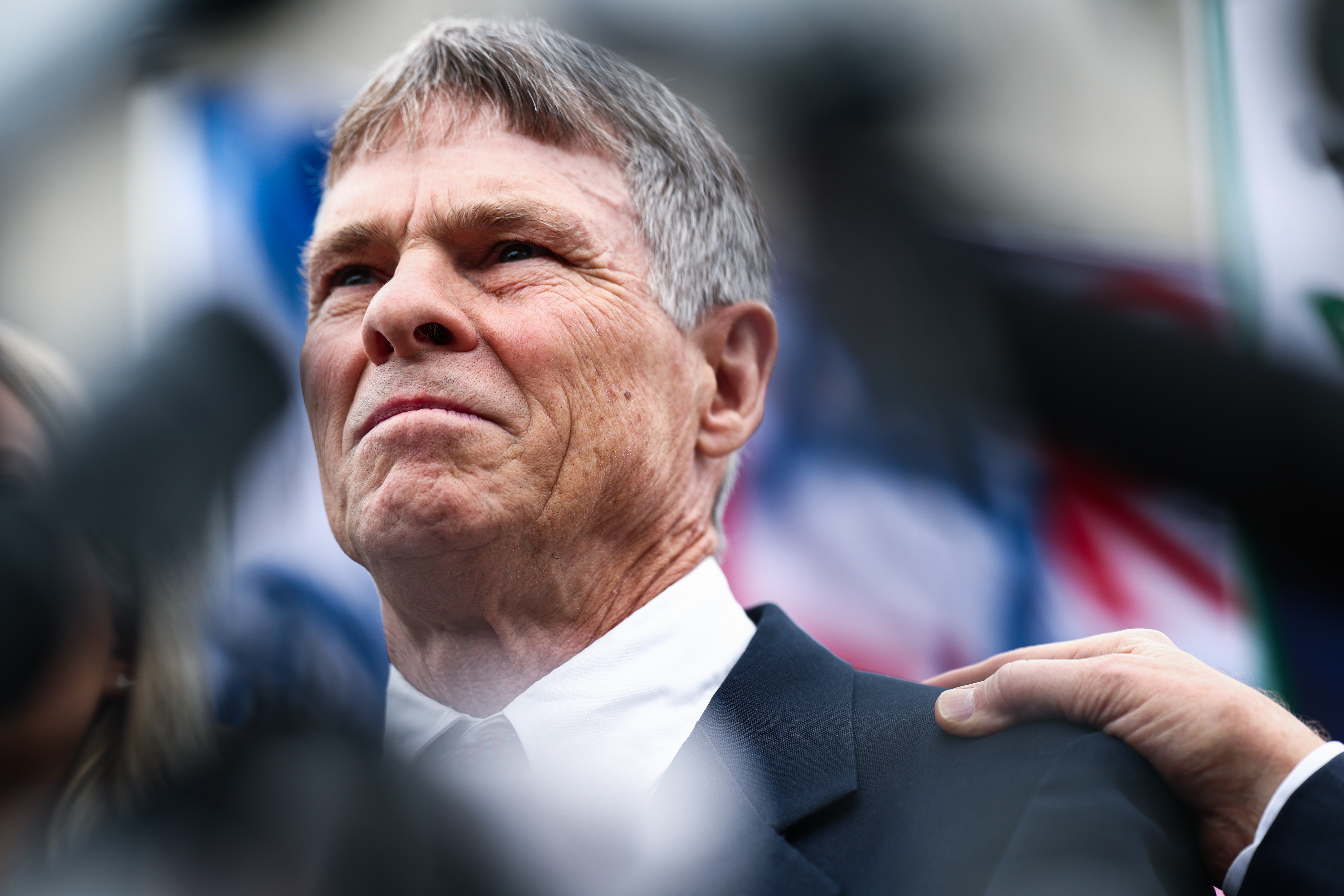Former Olympian David Hearn appears before reporters and others gathered outside a D.C. courthouse after his arraignment Thursday. (Finn Gomez/Getty Images)