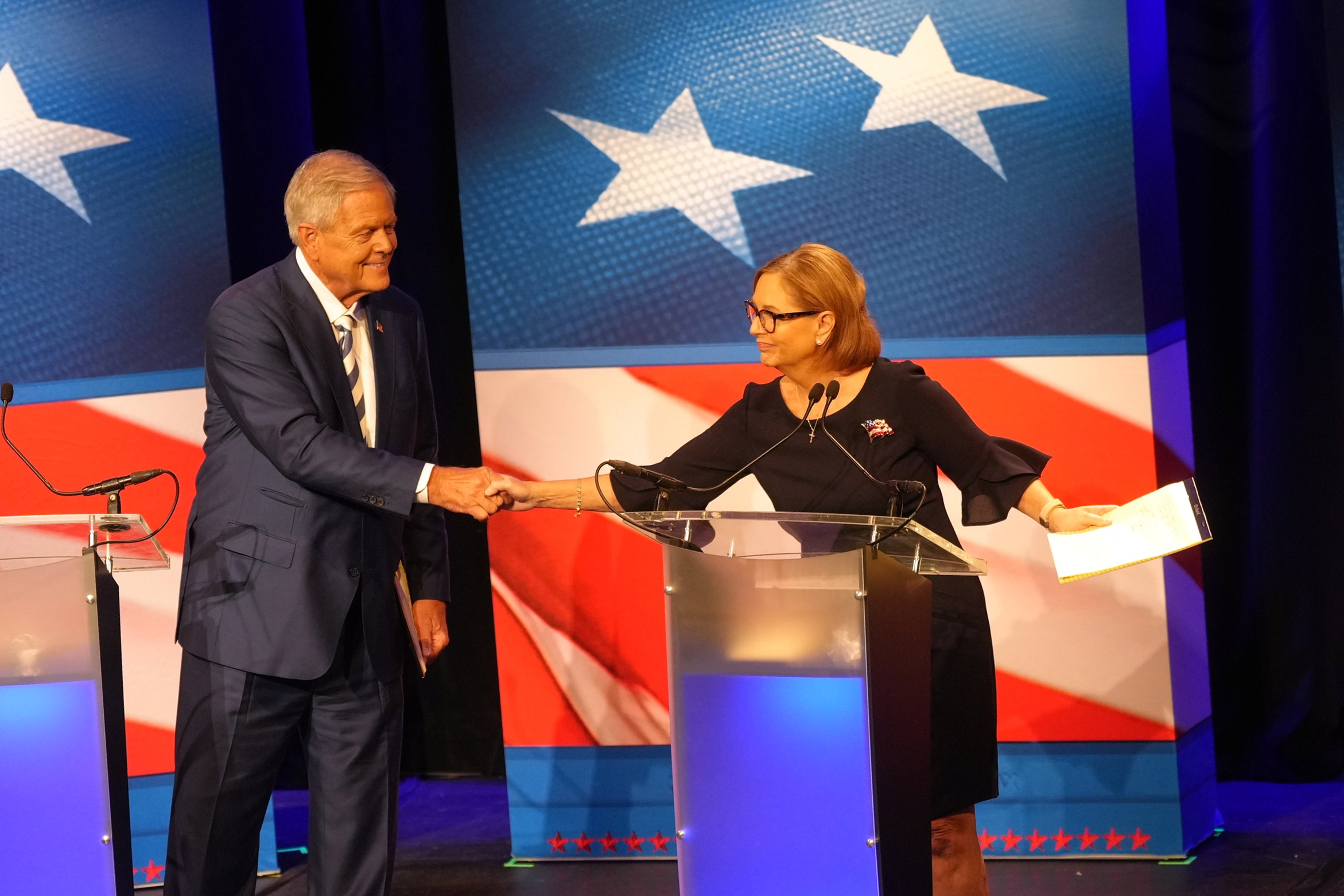 Ralph Norman shakes hands with Darline Graham ahead of a debate Tuesday in Newberry, South Carolina. (Meg Kinnard/AP)