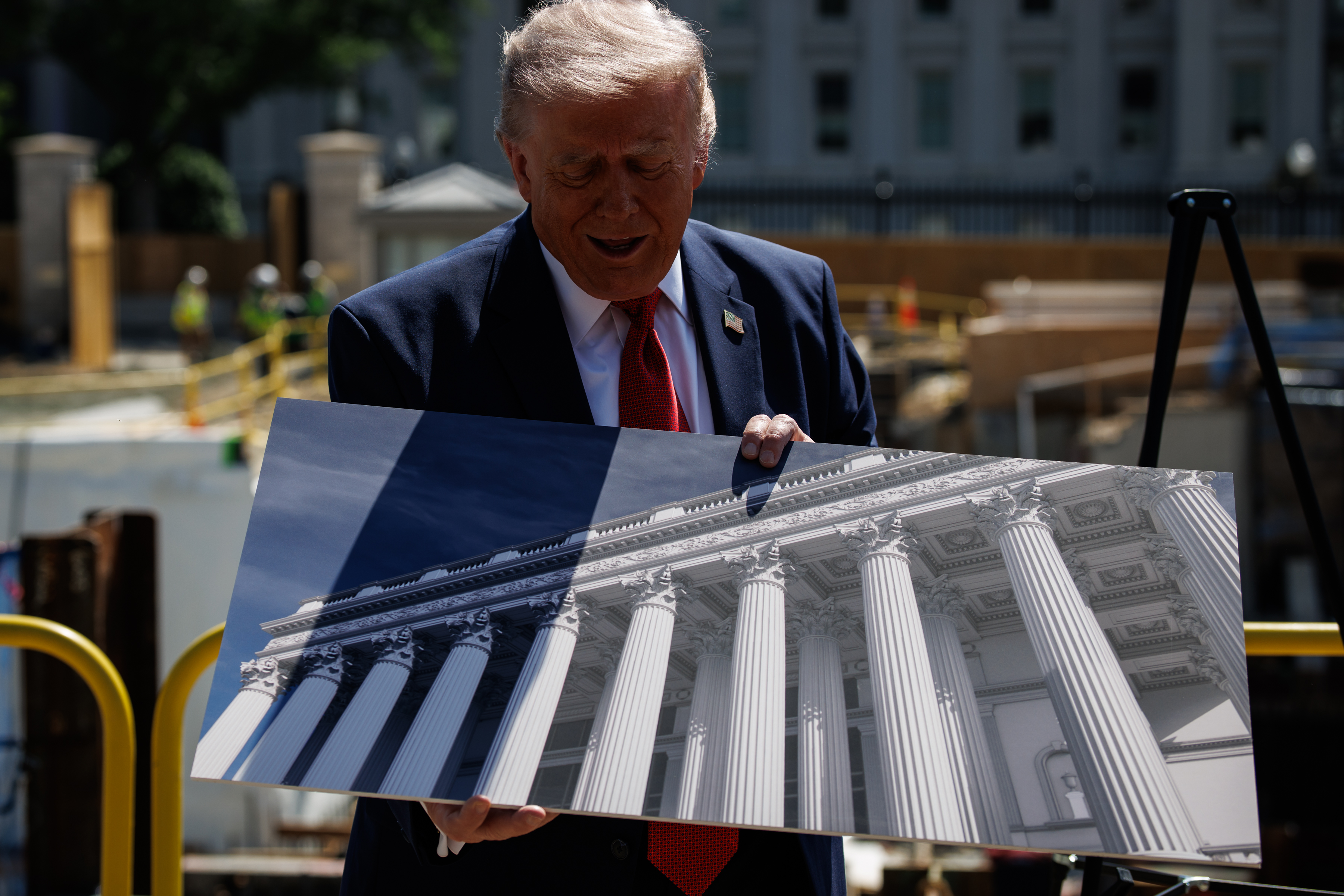 President Donald Trump speaks to reporters about construction at the former site of the East Wing on May 19. (Samuel Corum/Pool/FTWP)